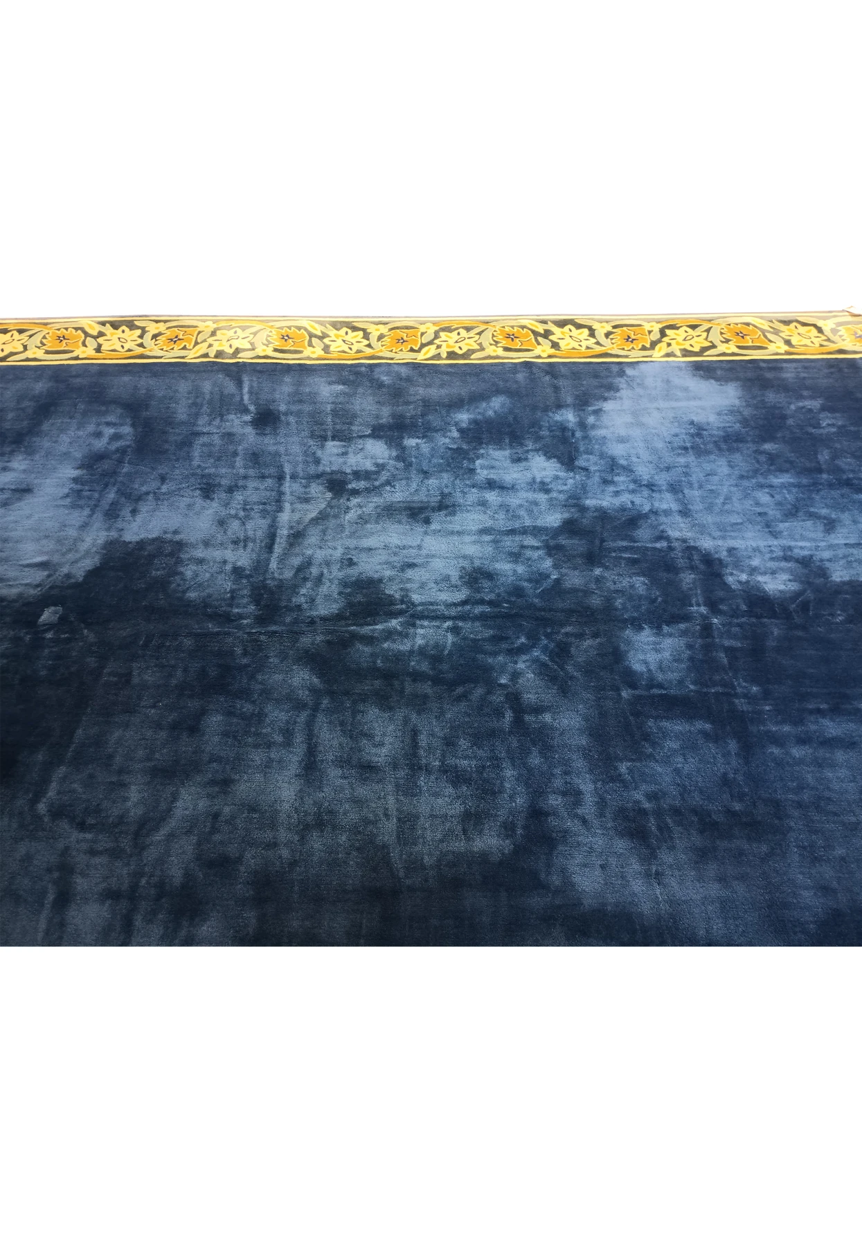 Close-up of the border on the 11' x 30' French Rug in yellow and gold tones.