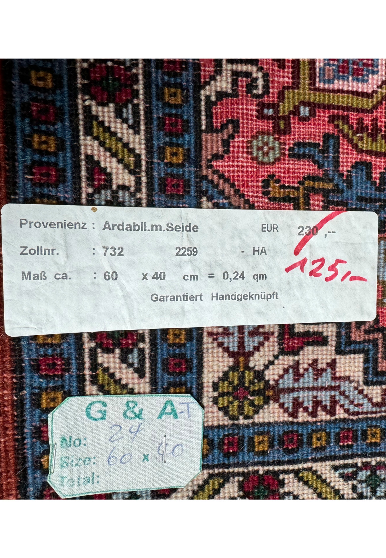 Label showing the origin and size details of the Persian Ardebil Wool and Silk Poshti Rug.