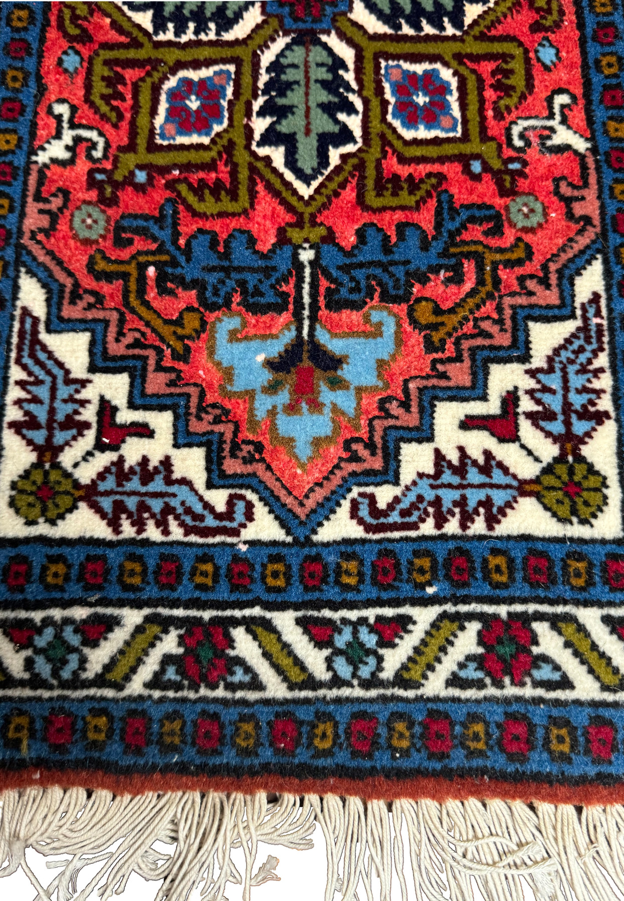 Detailed view of the lower part of the Persian Ardebil Wool and Silk Poshti Rug with geometric and floral motifs.