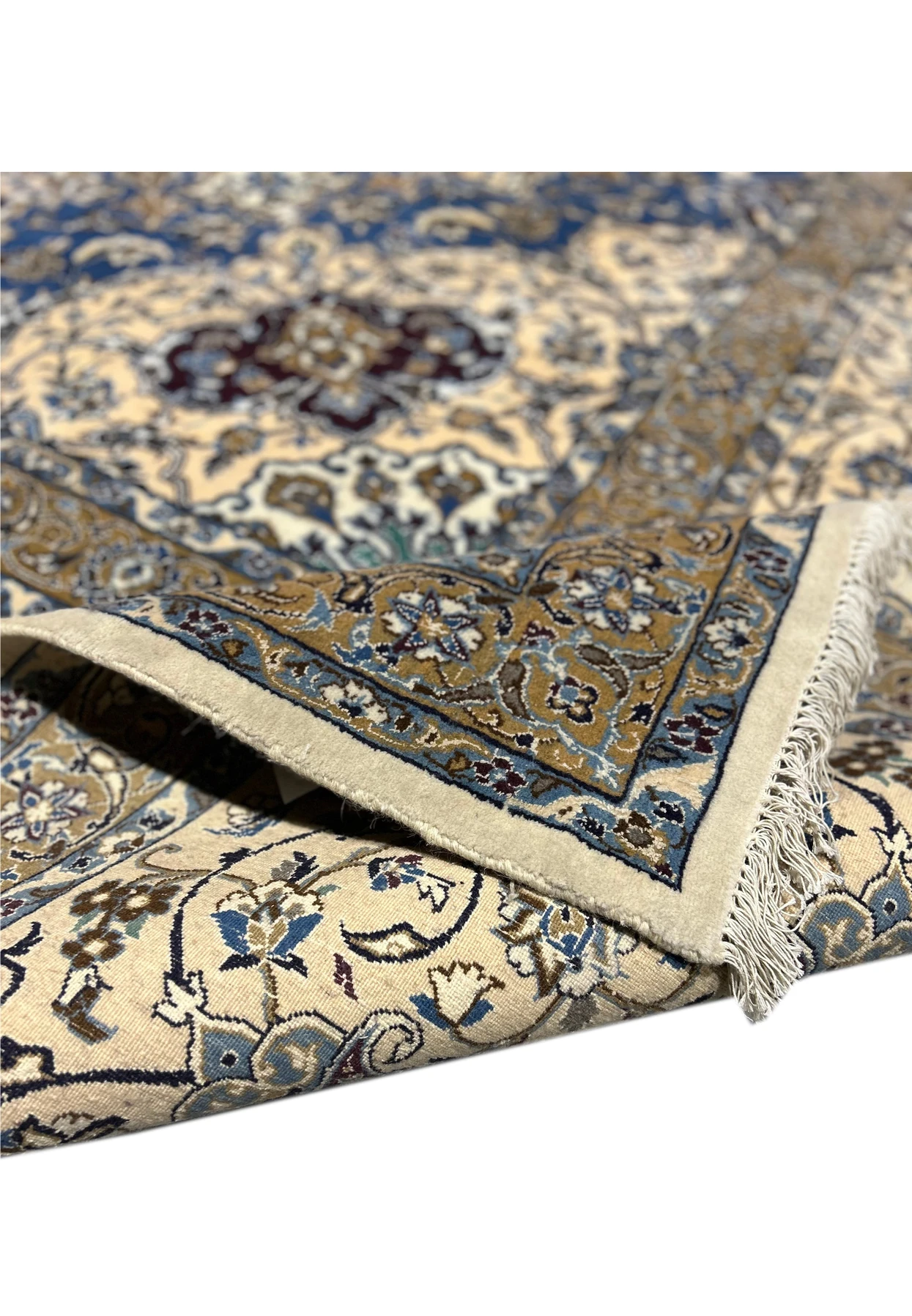 Backside of the 16' x 16' Persian Nain rug, showing the knotting and cotton foundation.