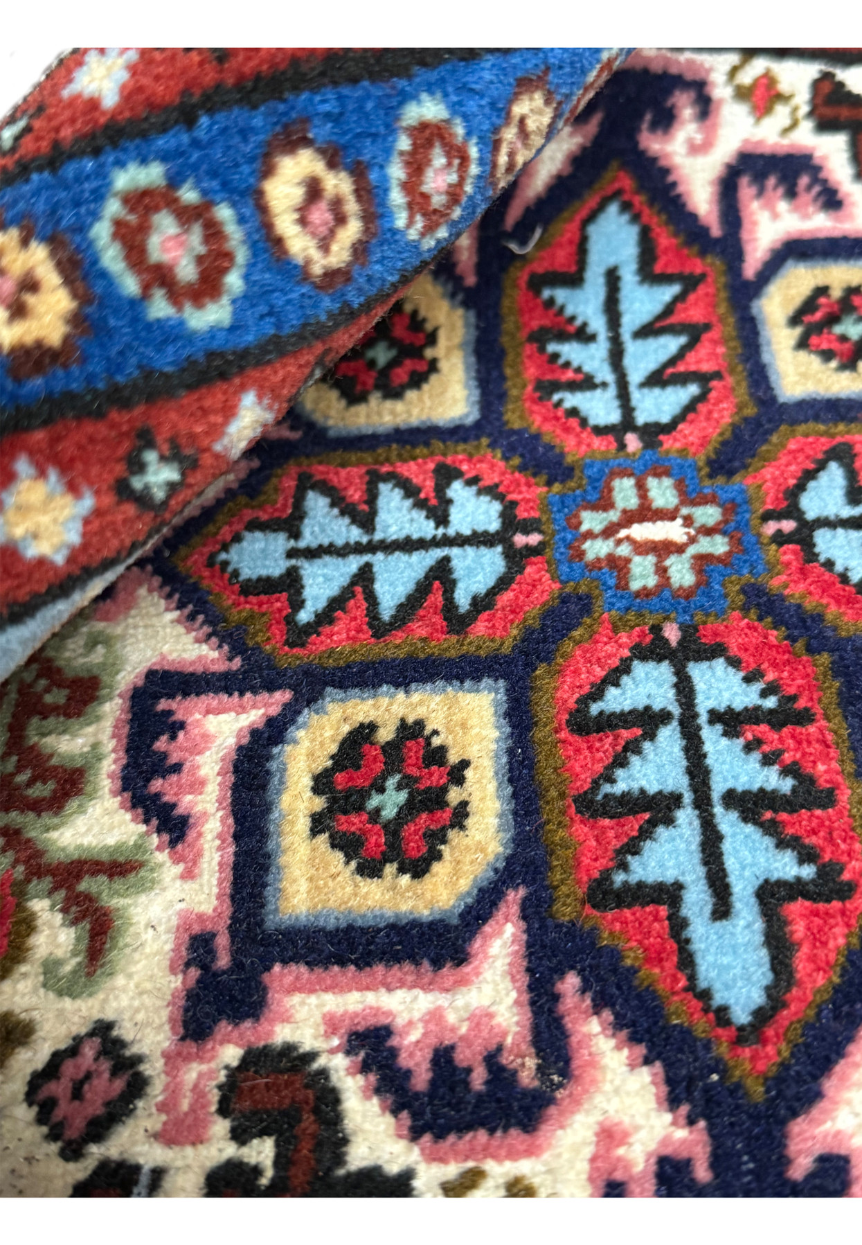 Rolled view of 1'3 x 2' Persian Ardebil Wool & Silk Poshti rug showcasing texture and quality.
