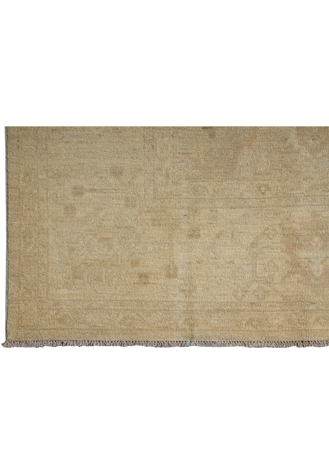 Corner of Chobi rug folded over to reveal the hand-knotted backing and fine craftsmanship of natural wool.