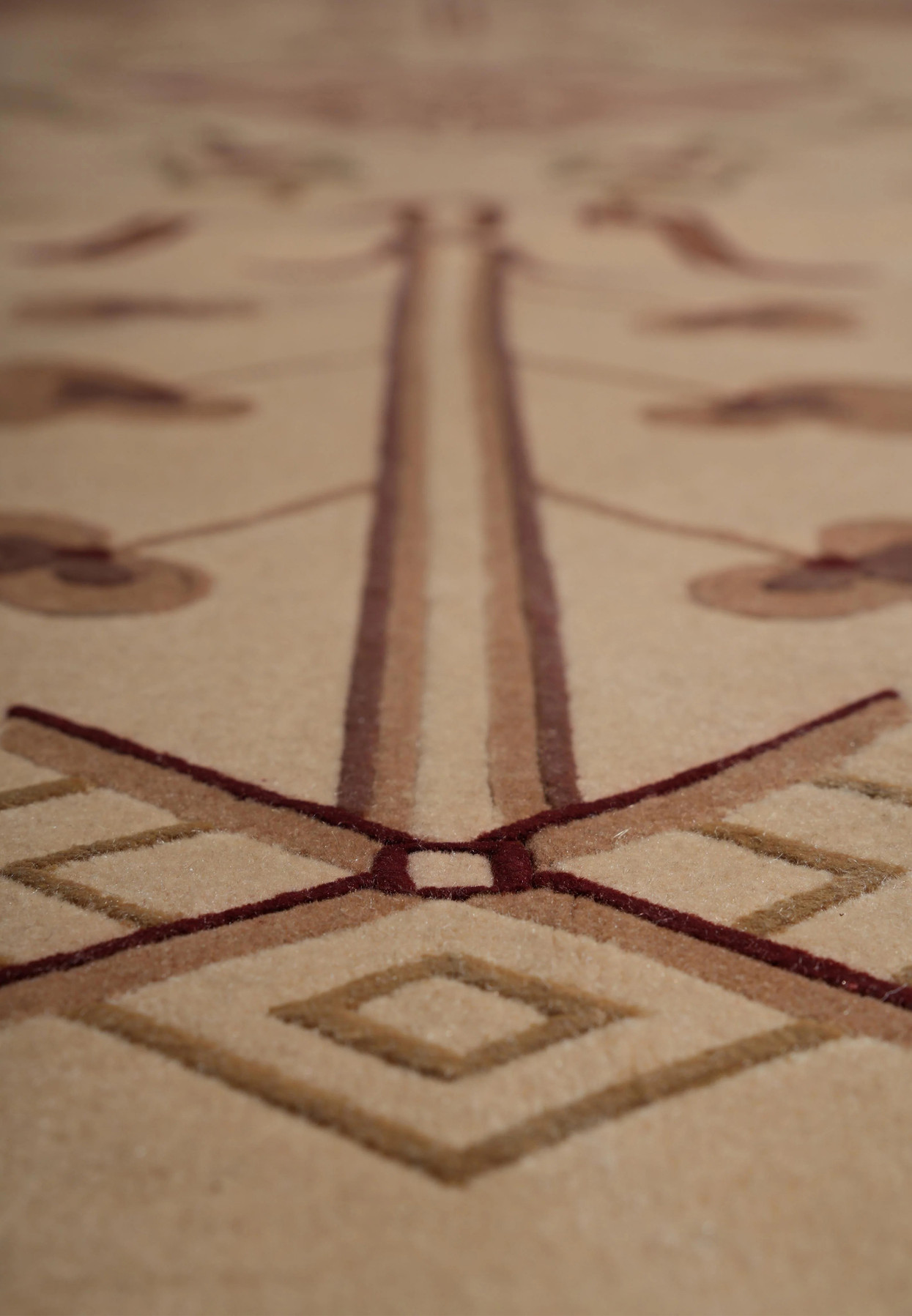 Zoomed design view showing abstract motifs and refined texture in wool and silk blend