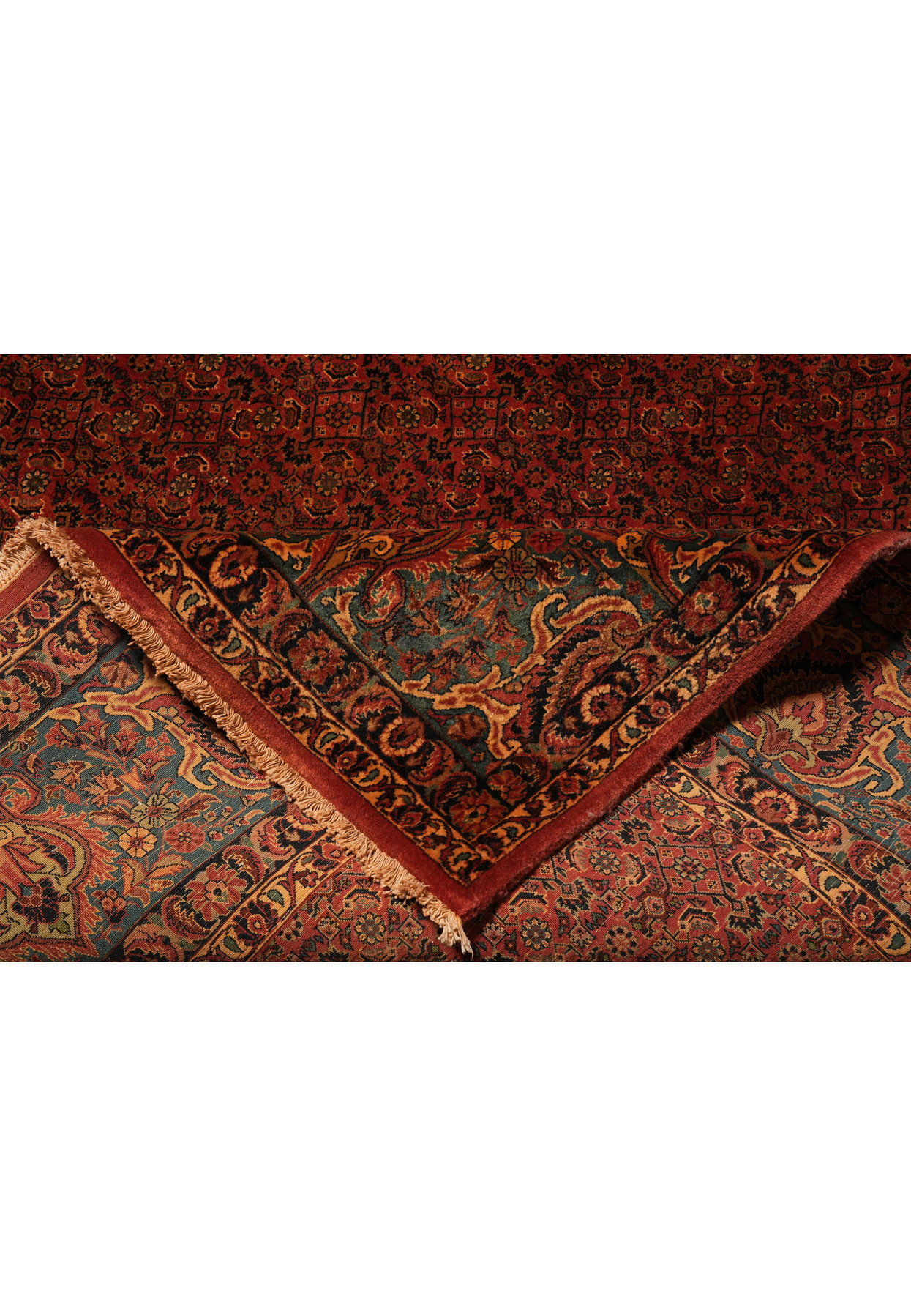 Folded antique Bijar rug highlighting dense wool pile and durability