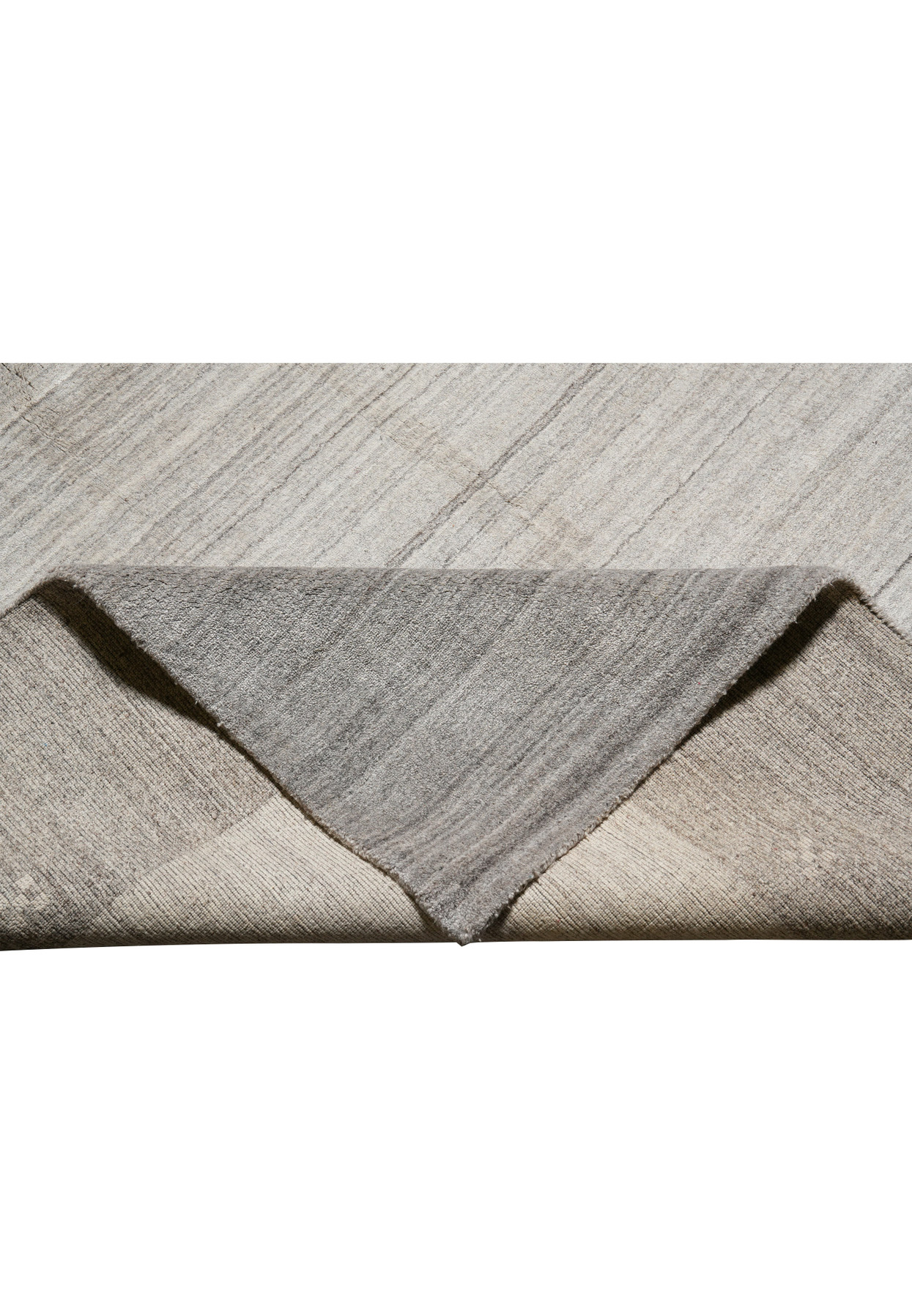 Detailed edge and border of plain gray wool contemporary rug with clean finish