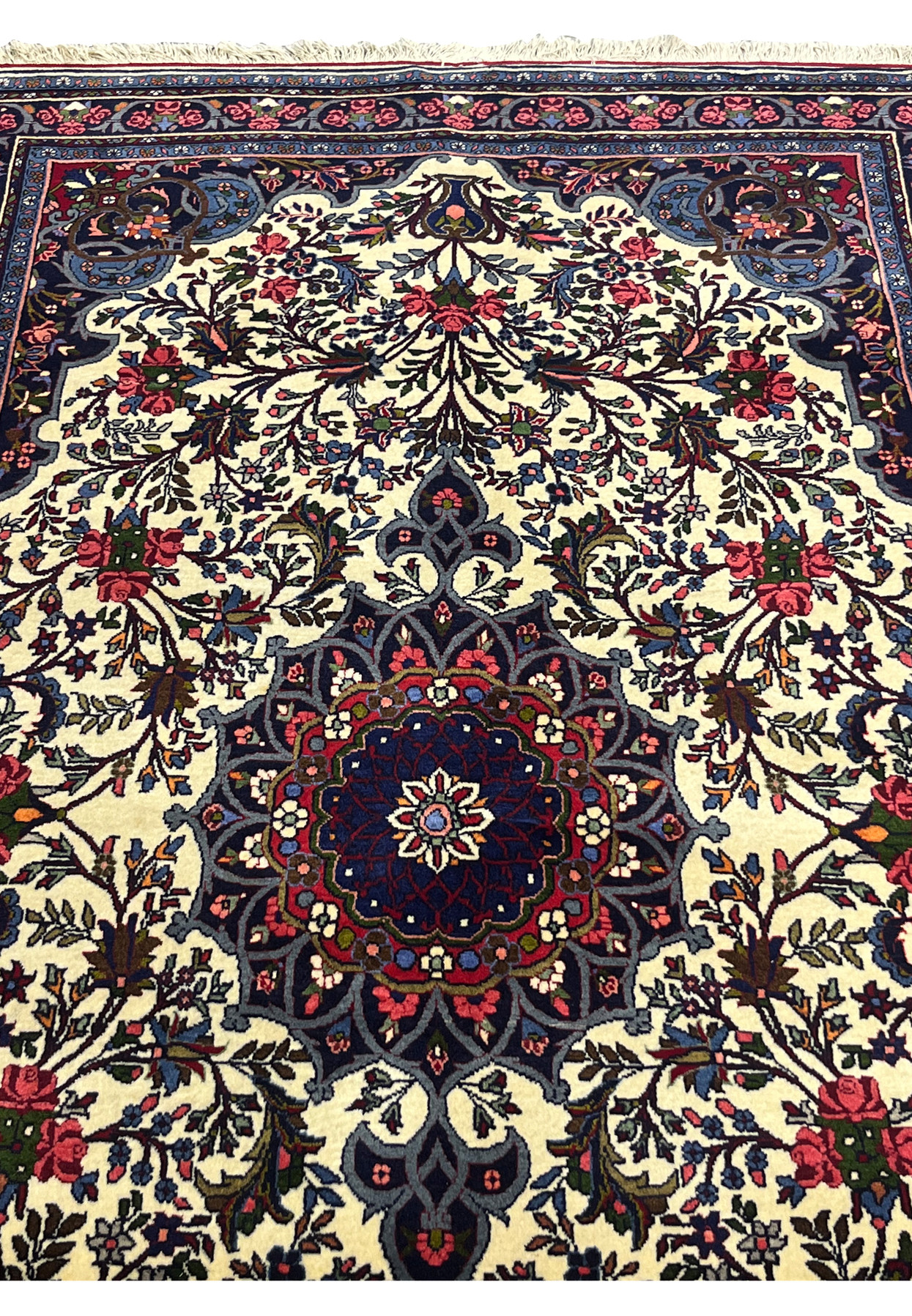 Midfield of 4'3 x 6'8 Persian Bijar Rug with ivory background, floral sprays, and navy blue accents