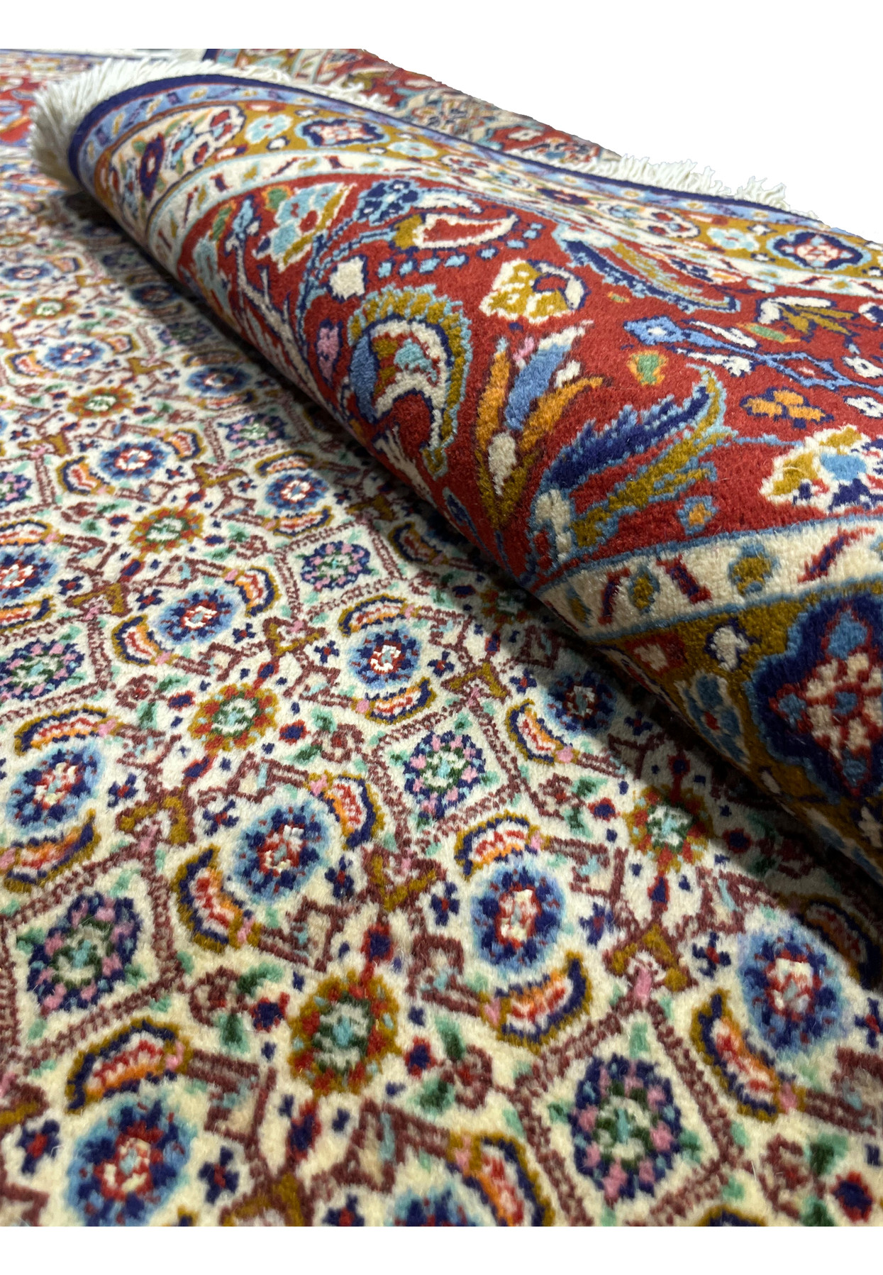 Rolled Persian Moud rug highlighting pile quality and border design