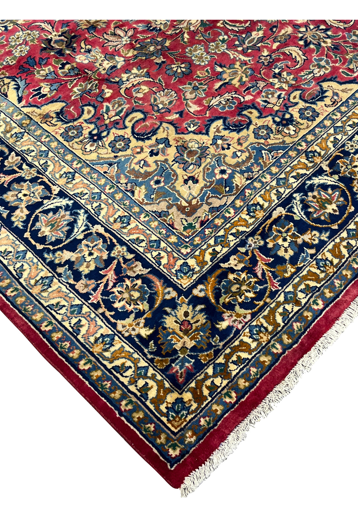 Angled corner view highlighting the rug’s dense pile, fine knotting, and aged patina in traditional Isfahan artistry.