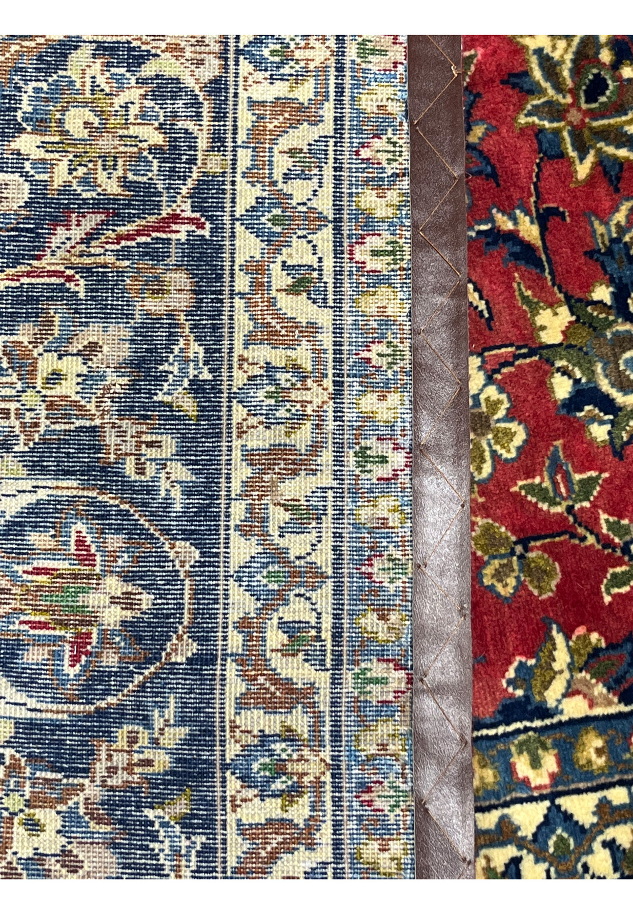 Alternate backside close-up of the 8'7 x 12'7 Distressed Persian Isfahan Rug, showing tight knots, even warp alignment, and rich multi-tone craftsmanship typical of Isfahan weaving.