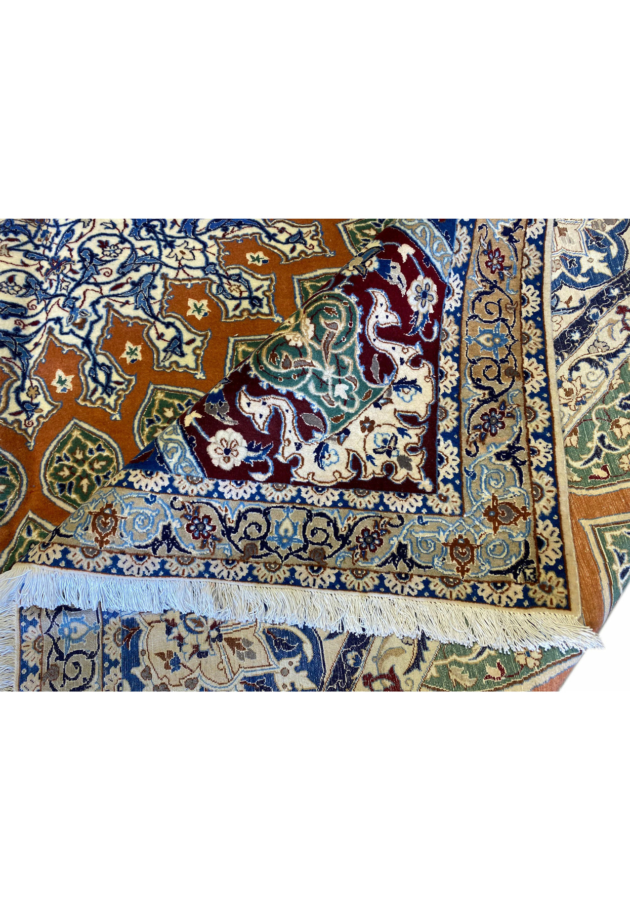 Folded corner view of the Persian Nain 6La rug revealing both front and back craftsmanship, showing the high-knot density, clean weaving lines, and soft silk-wool blend texture.