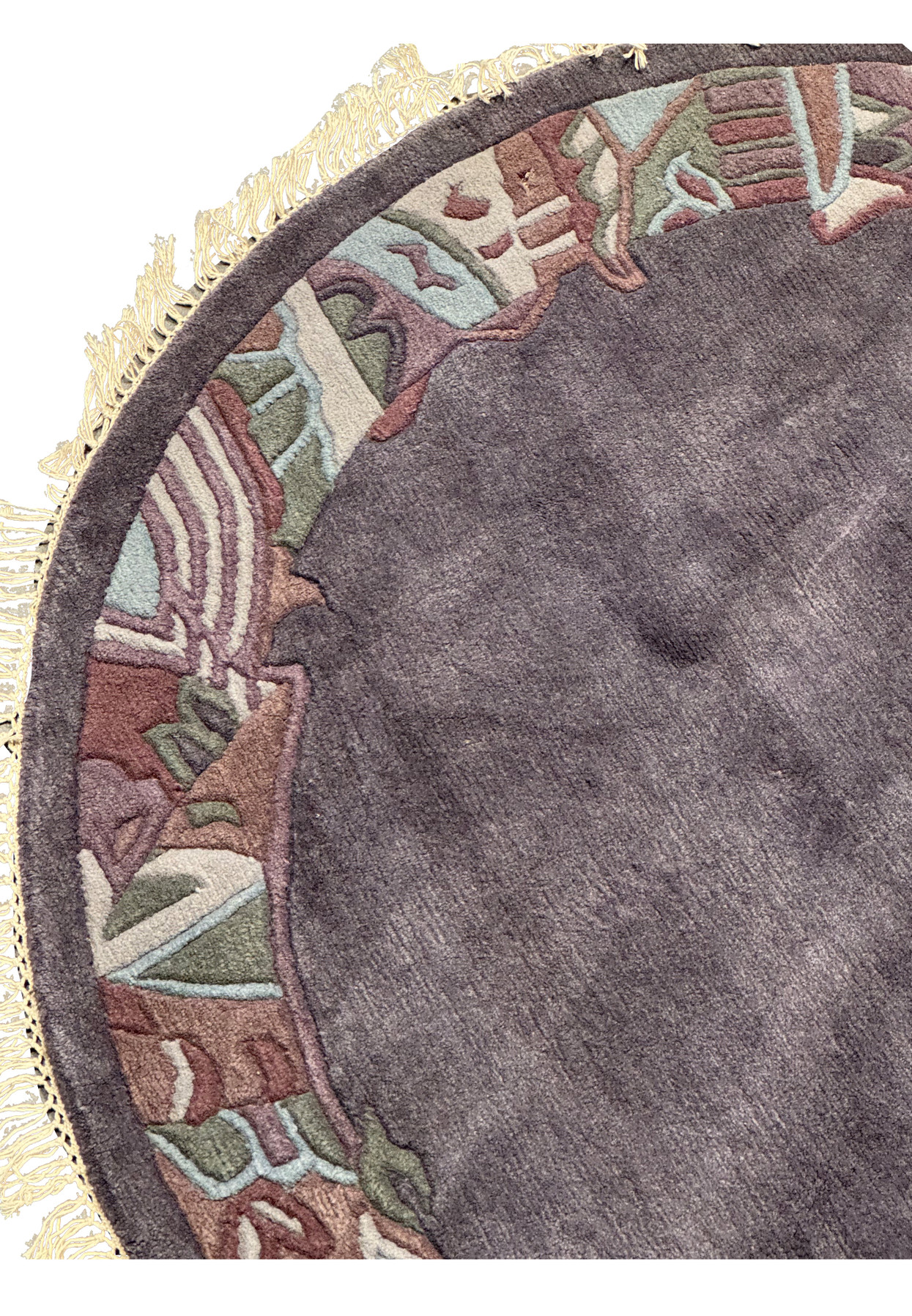 Close-up of the Modern Nepal Rug’s abstract geometric border, revealing hand-carved motifs in olive green, burgundy, and light blue contrasting the deep gray background.
