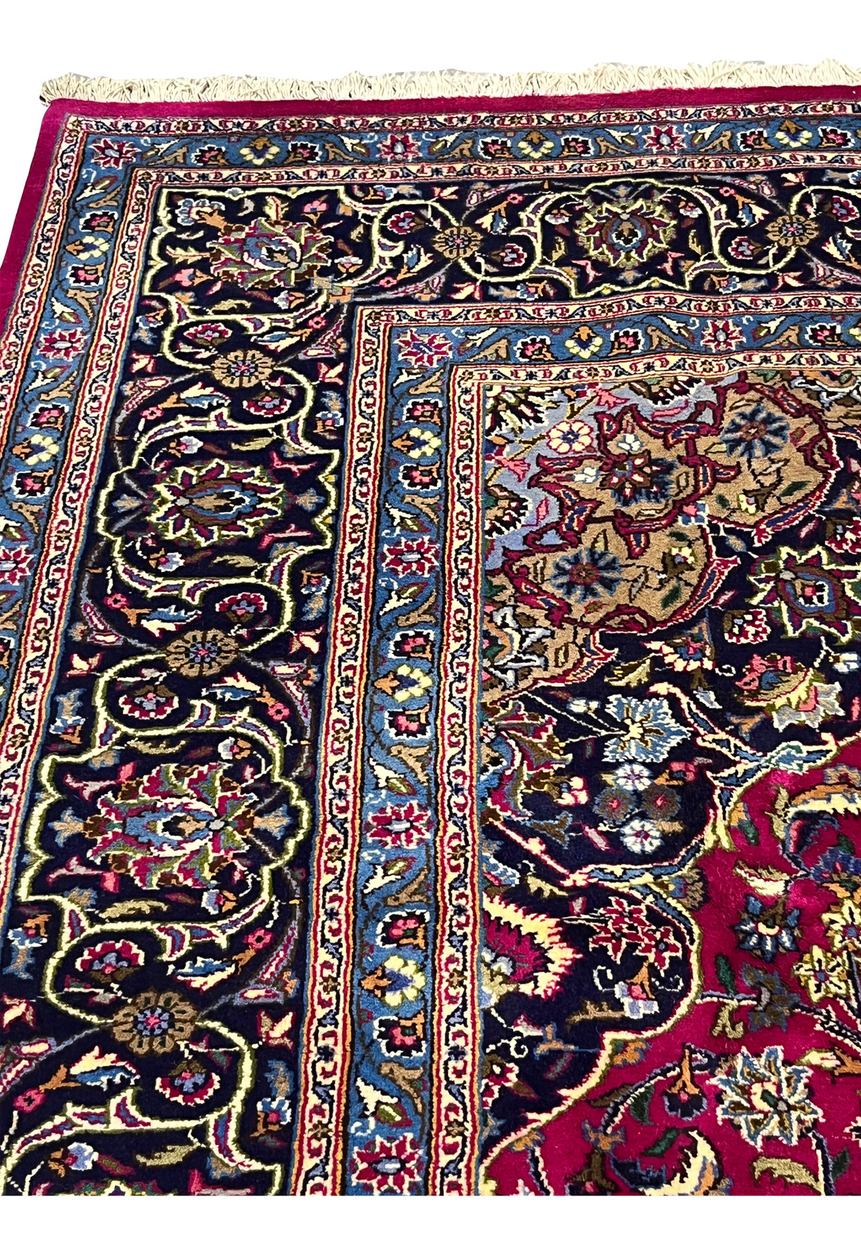 Border section of Persian Mashad rug with deep navy ground and scrolling floral pattern.