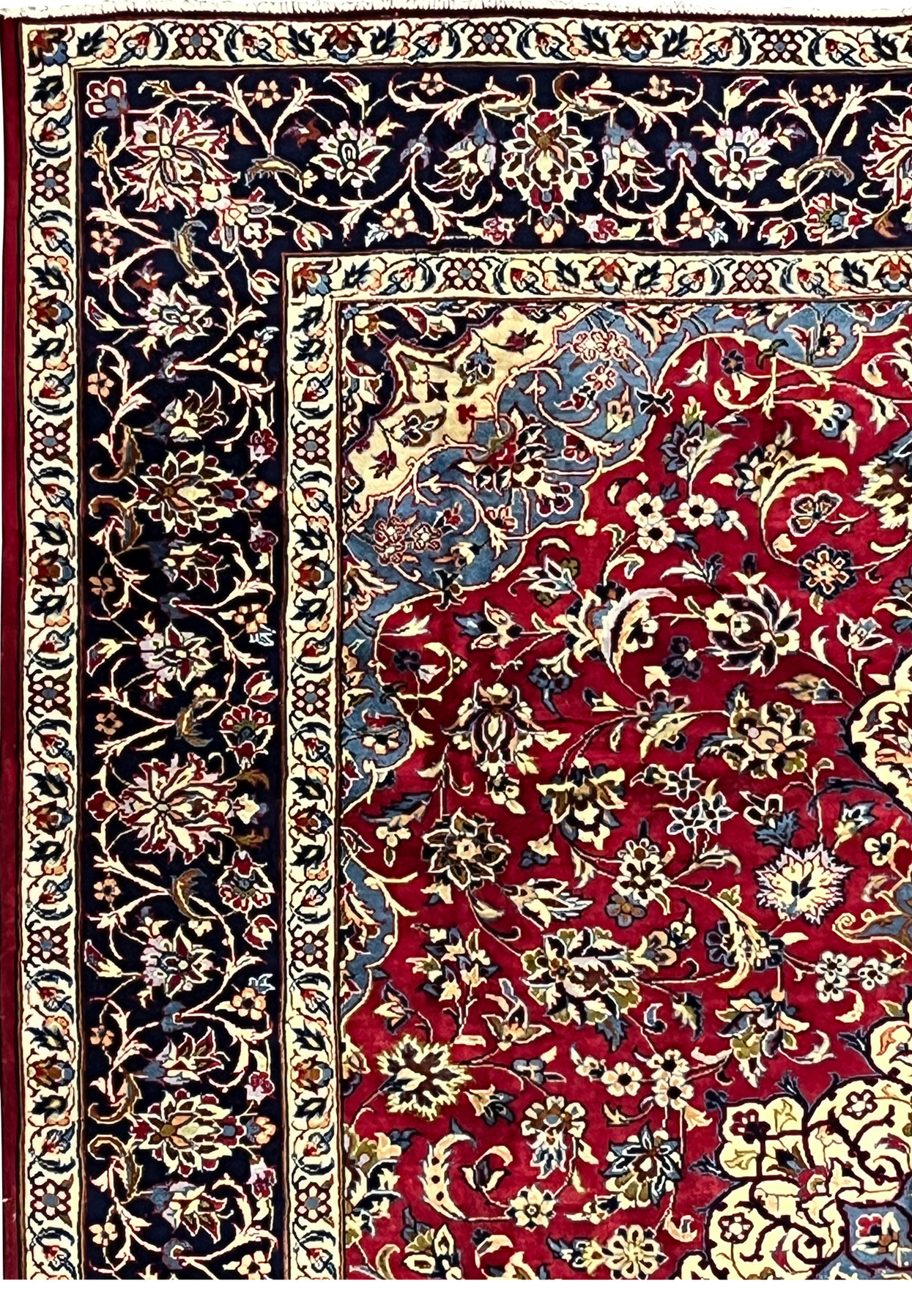Border of 8'5 x 11'8 Persian Isfahan rug showing navy vines, ivory outlines, and detailed blossoms.