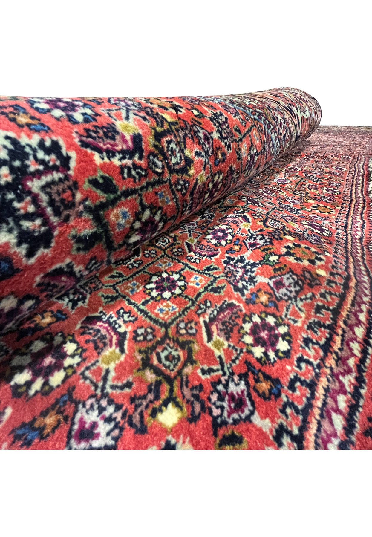 Rolled angle view highlighting the thick wool pile and detailed floral pattern of the Bijar Persian Iron Rug.