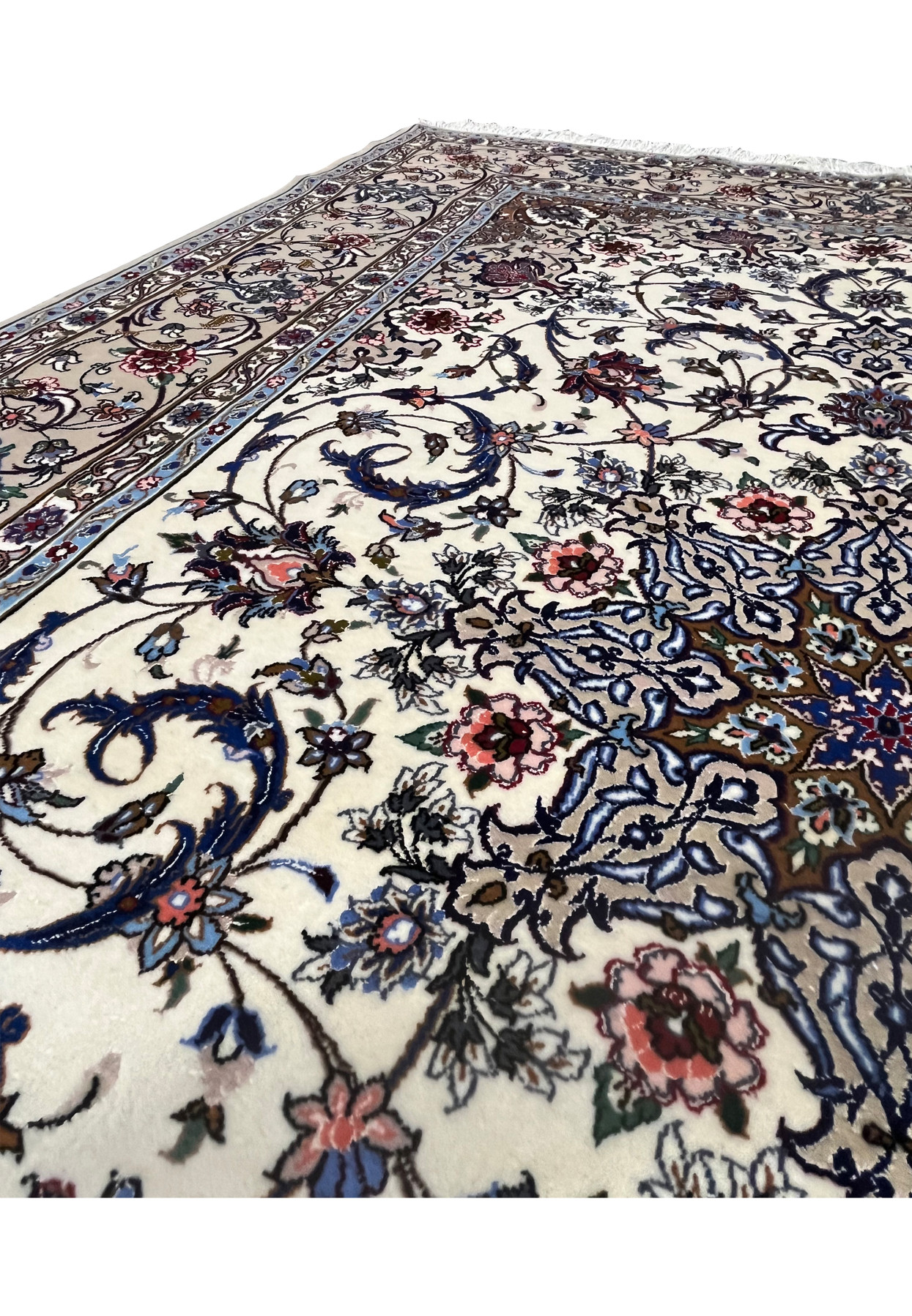 Detailed floral pattern showing vines, roses, and silk accents on the ivory field of the Davari Isfahan rug.