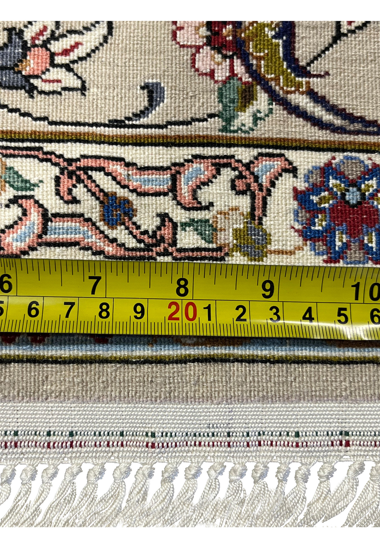 Back view of the Persian Isfahan rug showing tight knotting, crisp pattern clarity, and detailed floral design visible through the foundation.