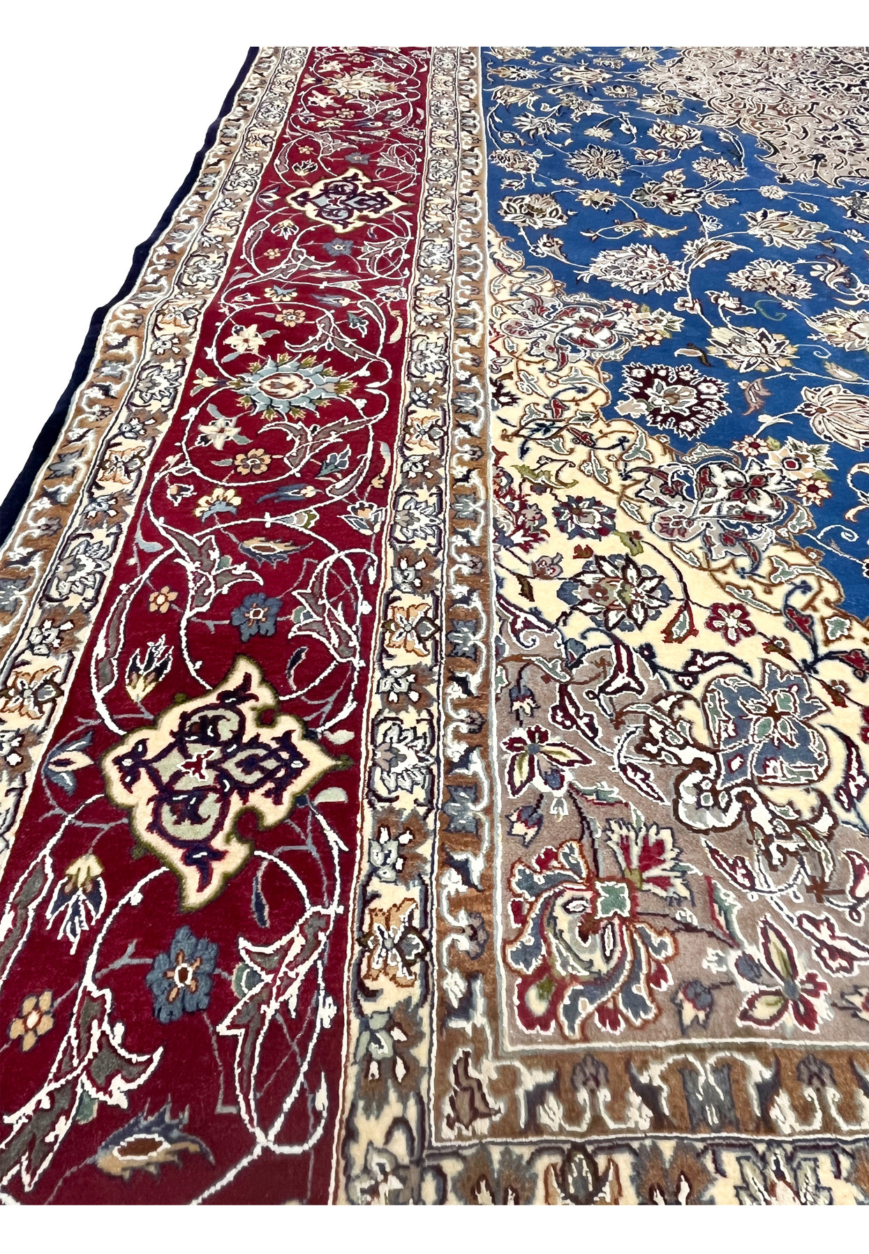 Side border view showing floral scrollwork in the red band and transition into the ivory and beige inner border.