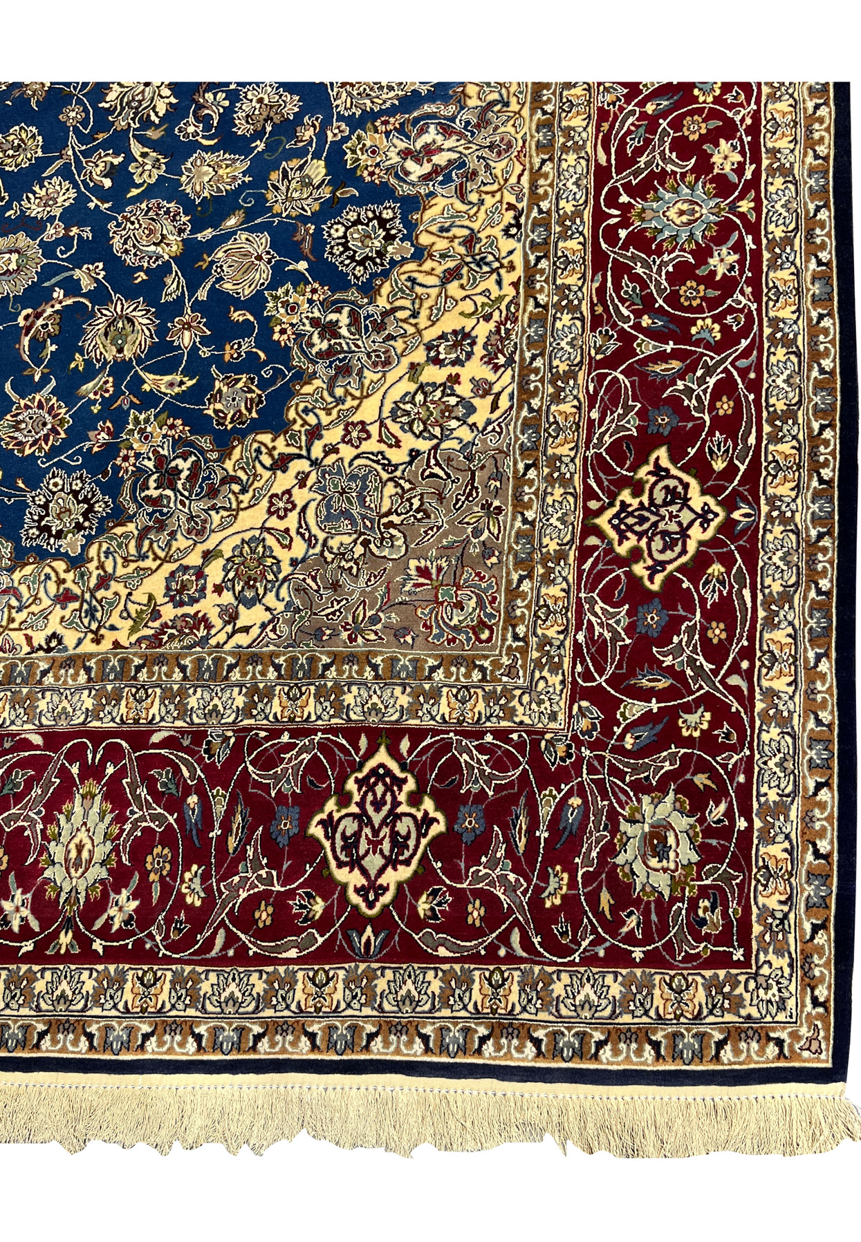 Border close-up showing the red outer band with floral patterns and the surrounding ivory and beige guard borders of the Isfahan rug.