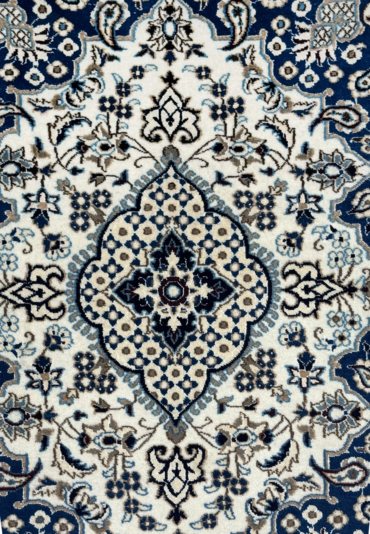 Close up of ivory and powder blue medallion on royal navy blue Persian Nain rug with mocha brown outlines and floral rosette pattern