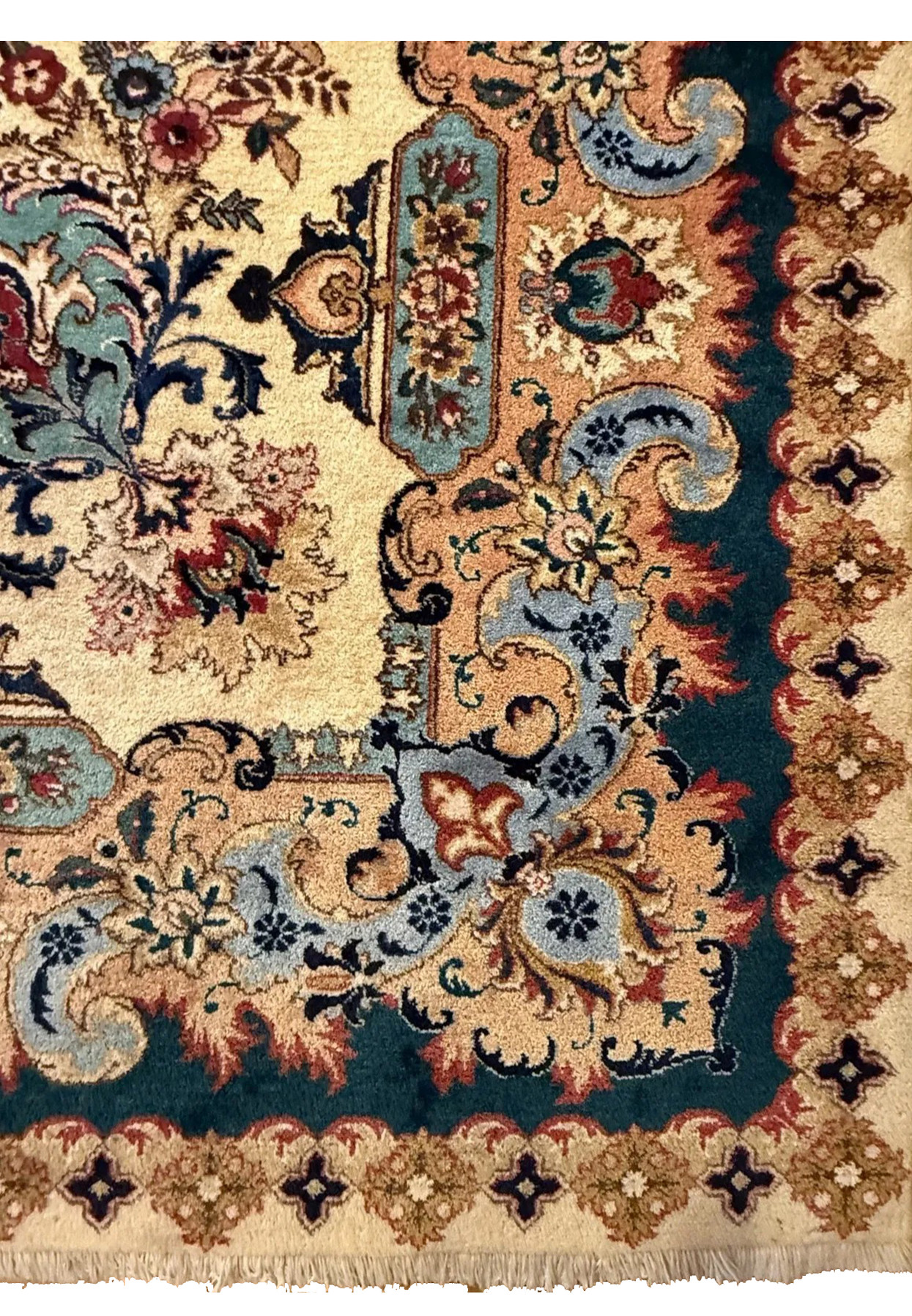 Full border detail showing teal main border with coral medallions and slate blue decorative scrolls