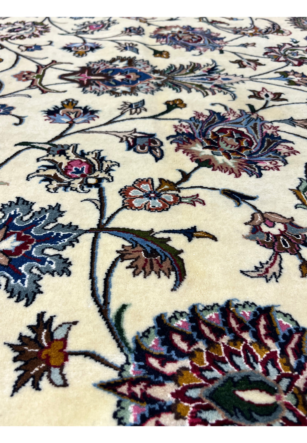 Detailed floral vine and palmette pattern on signed Persian Mashad Saber rug