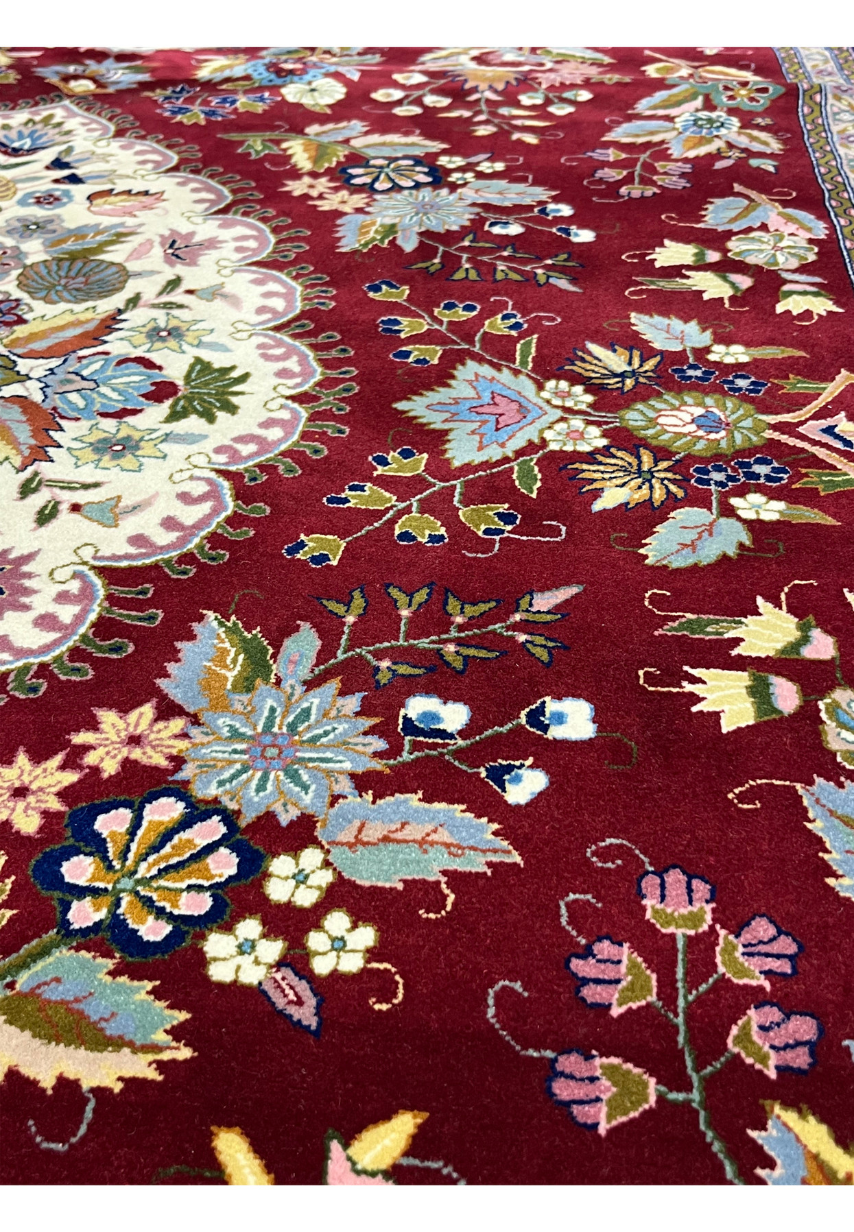 Close-up of hand knotted wool and silk foundation on Persian Isfahan rug showing fine knot structure