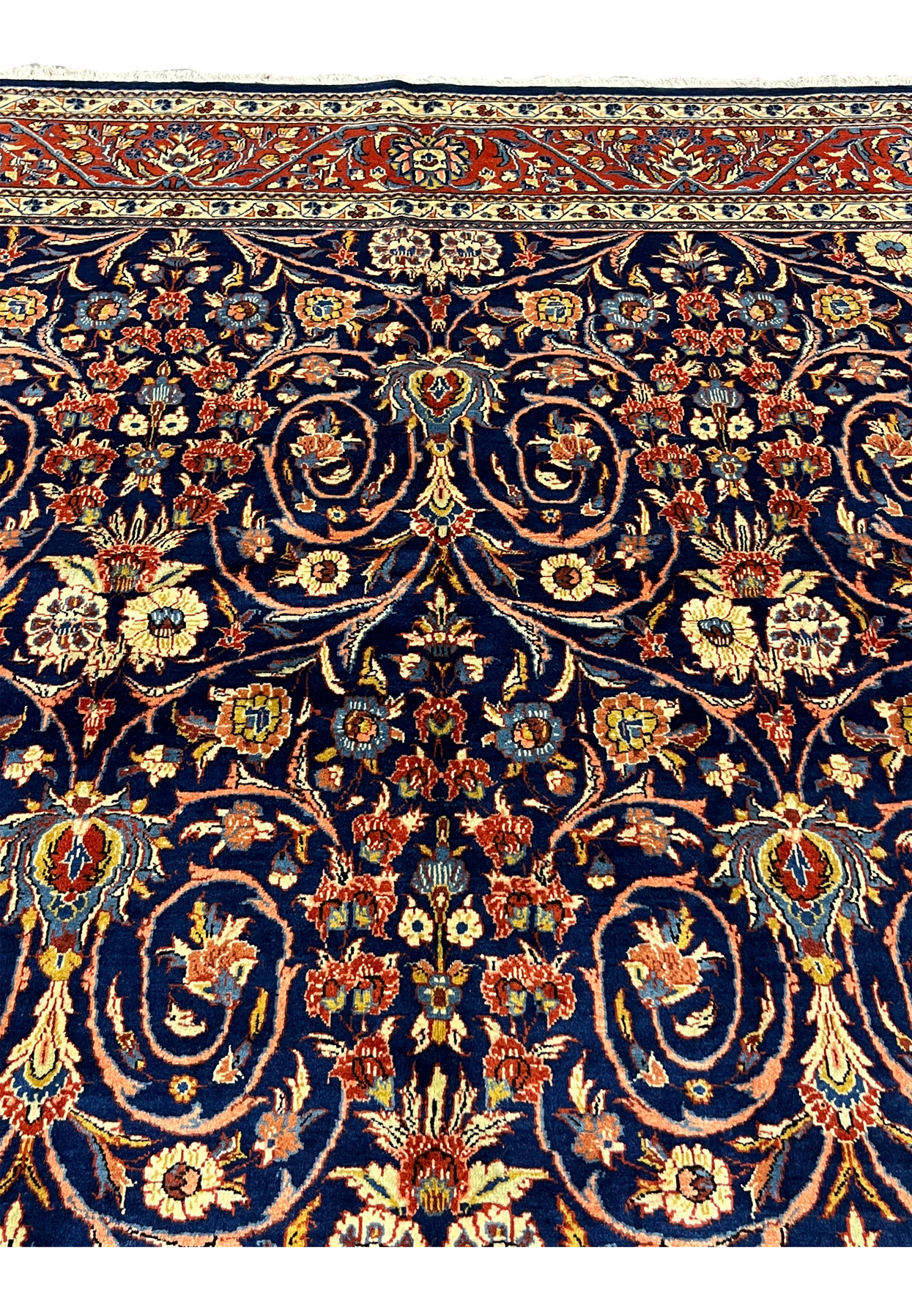 Upper border detail of Persian Sarough rug with red ground, ivory accents, and traditional floral patterns