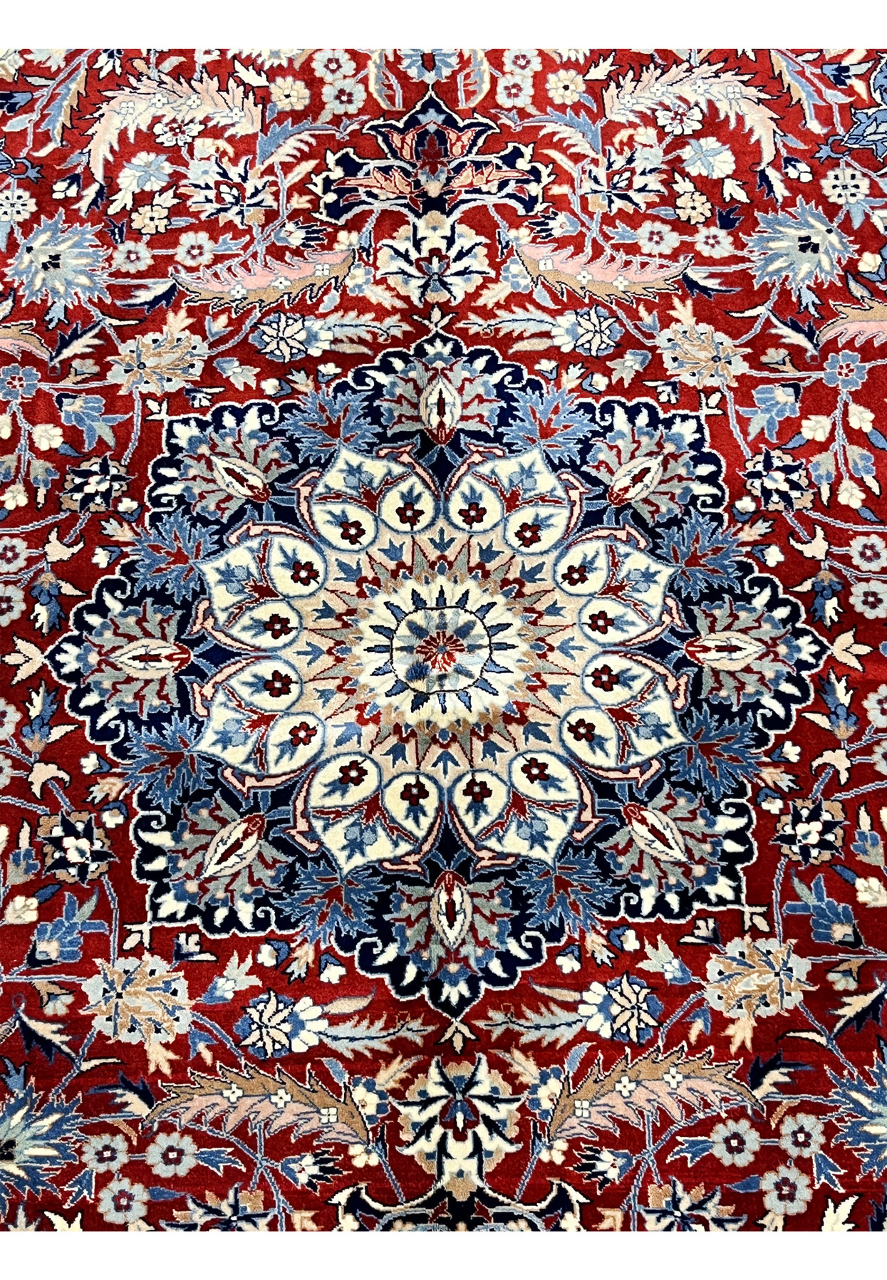 Detailed medallion view with ivory petals, navy and light blue outlines, and burgundy field filled with floral vines