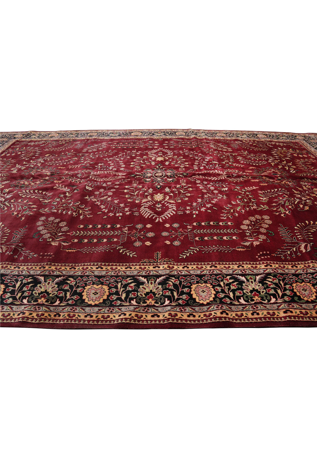 Oversized 12'8 x 20'5 Oriental Sarough rug laid flat, featuring a deep red field with dense traditional floral motifs and a dark navy border
