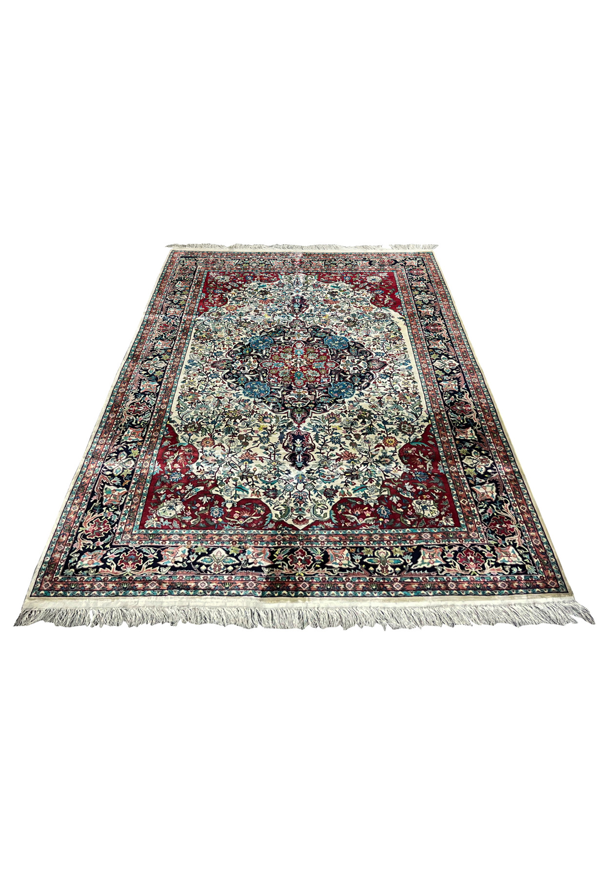 6 x 9 hand knotted silk rug laid flat showing full floral medallion composition
