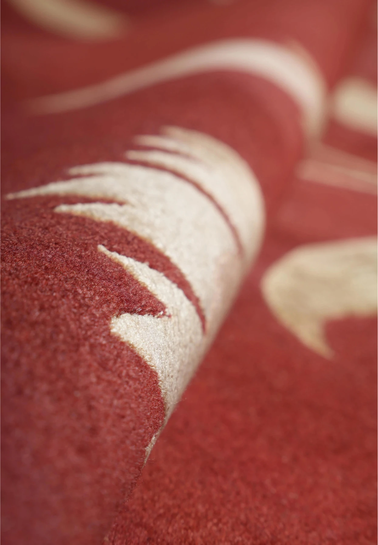 Close-up texture view of a modern Tibetan rug highlighting the soft New Zealand wool pile combined with silk accents that reflect light naturally