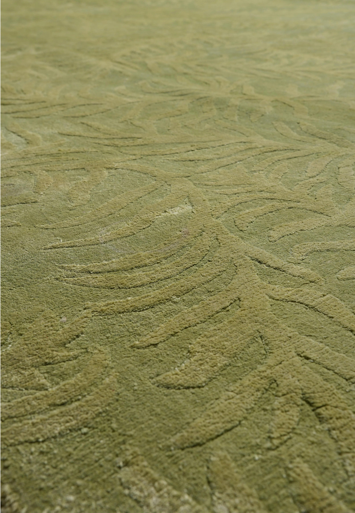 Close-up of the cotton foundation backing that supports the durable handmade construction of this modern rug.