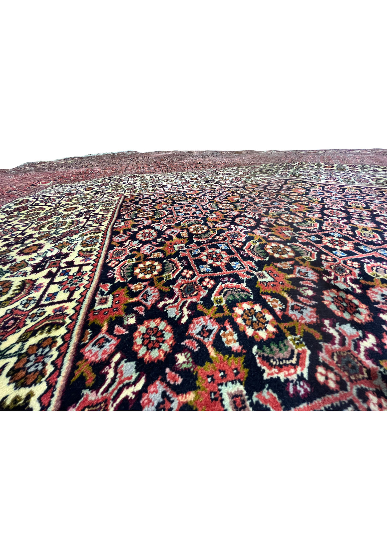Detailed color view showing layered red shades and crisp contrast in a high-density Persian Bijar iron rug