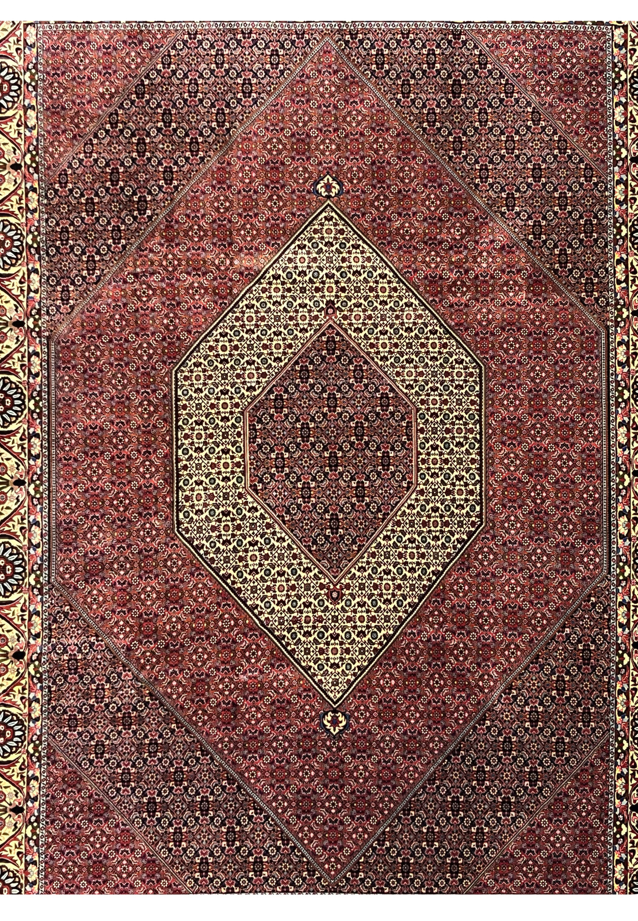 Midfield detail highlighting dense geometric motifs and tight knotting in a Persian Bijar iron rug