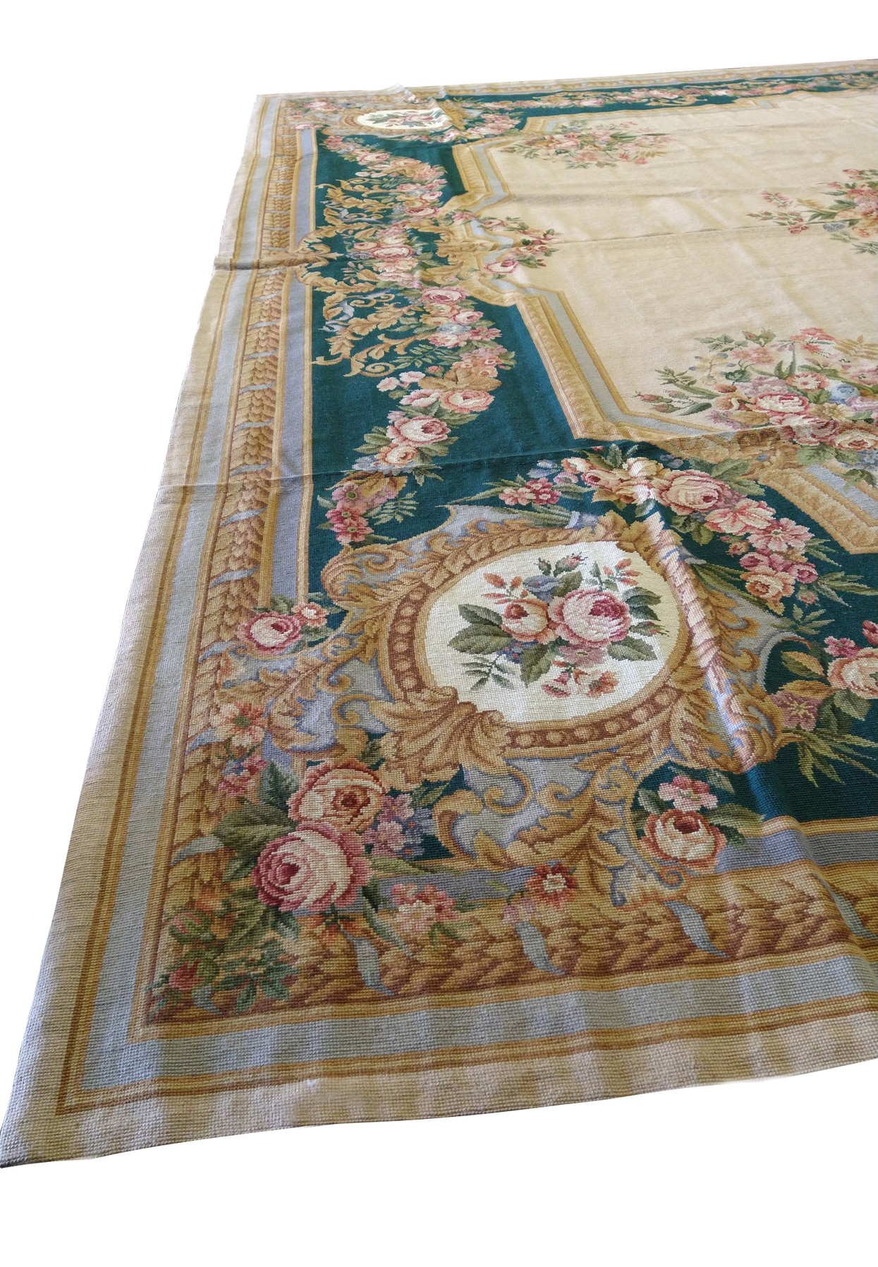 Complete composition view of French Aubusson rug featuring beige ground, emerald green border, floral medallion, and classic European styling