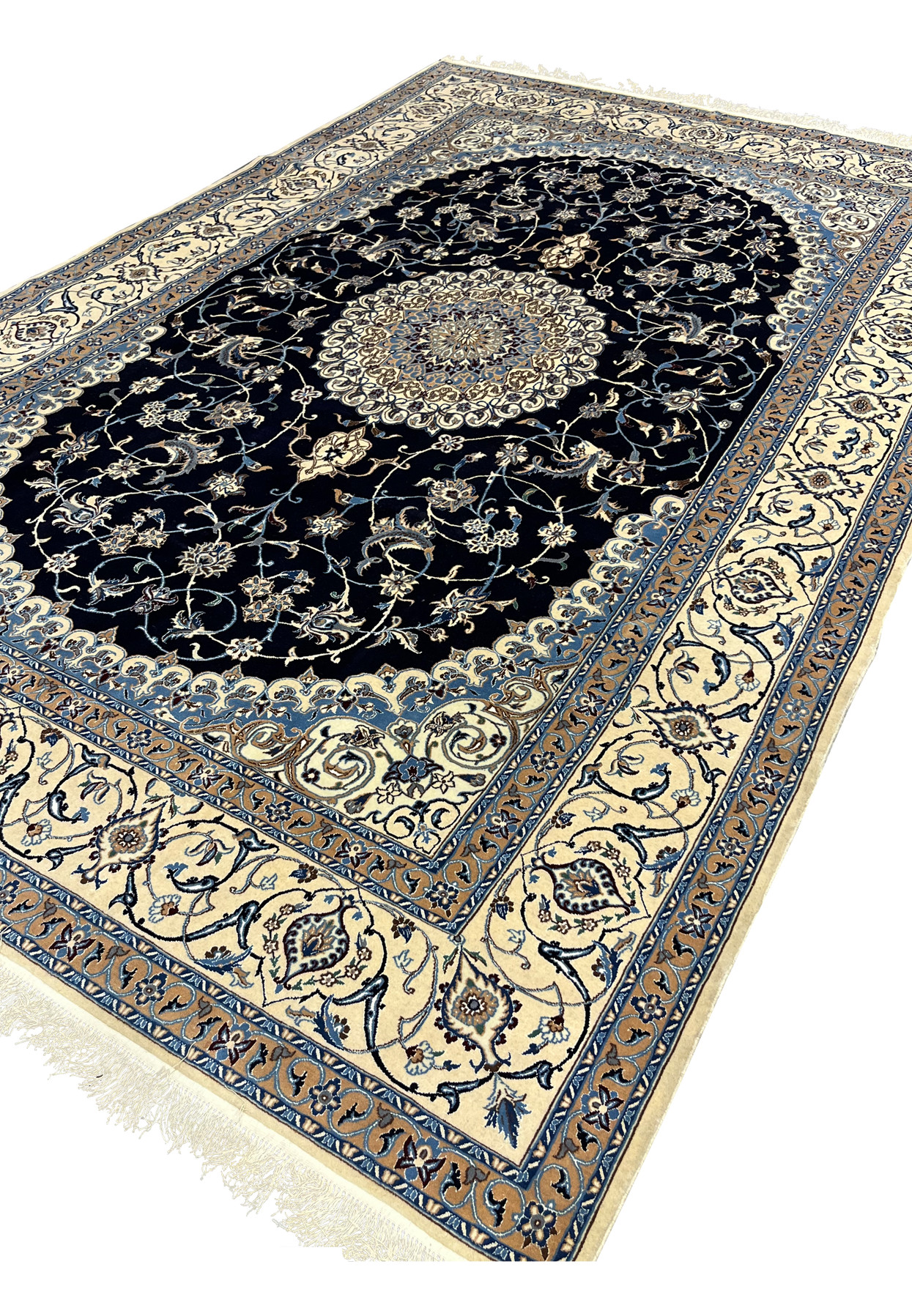 Angled perspective of Persian Nain 6 LA silk rug highlighting pile texture, navy field depth, ivory border contrast, and crisp floral definition throughout