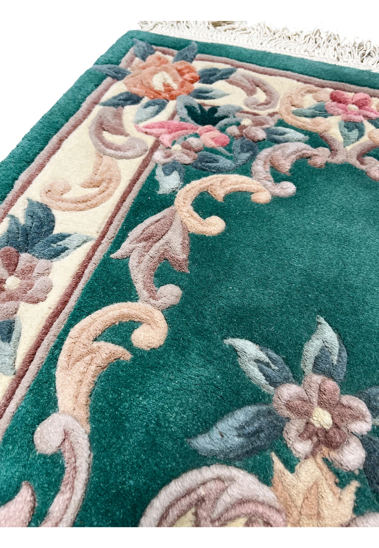 Upper border detail of Aubusson Art Deco rug showing ivory framing, floral scroll motifs, and carefully defined raised weaving