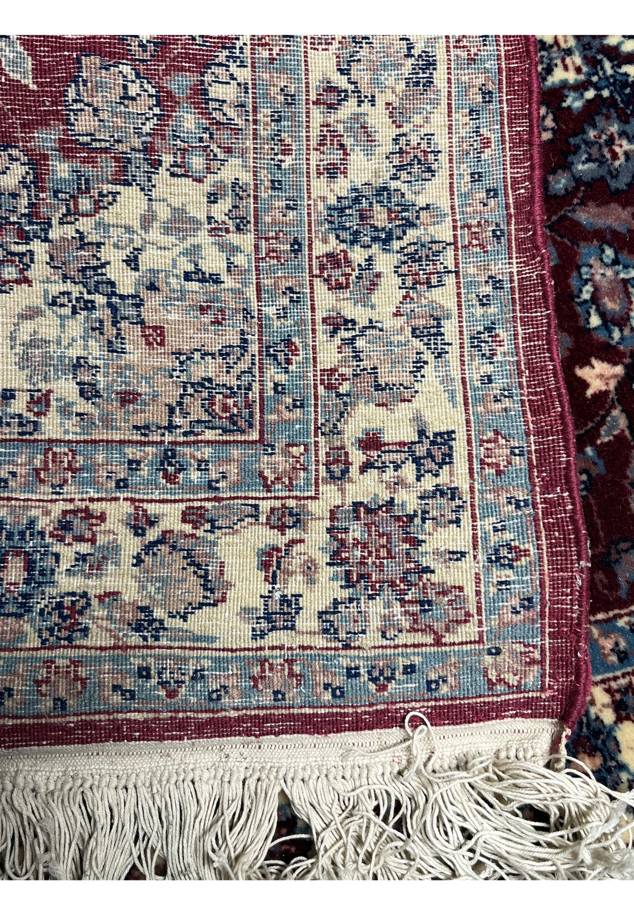 Backside view of a Persian Tabriz rug revealing tight knot density, clear pattern visibility, strong foundation, and authentic hand-knotted construction