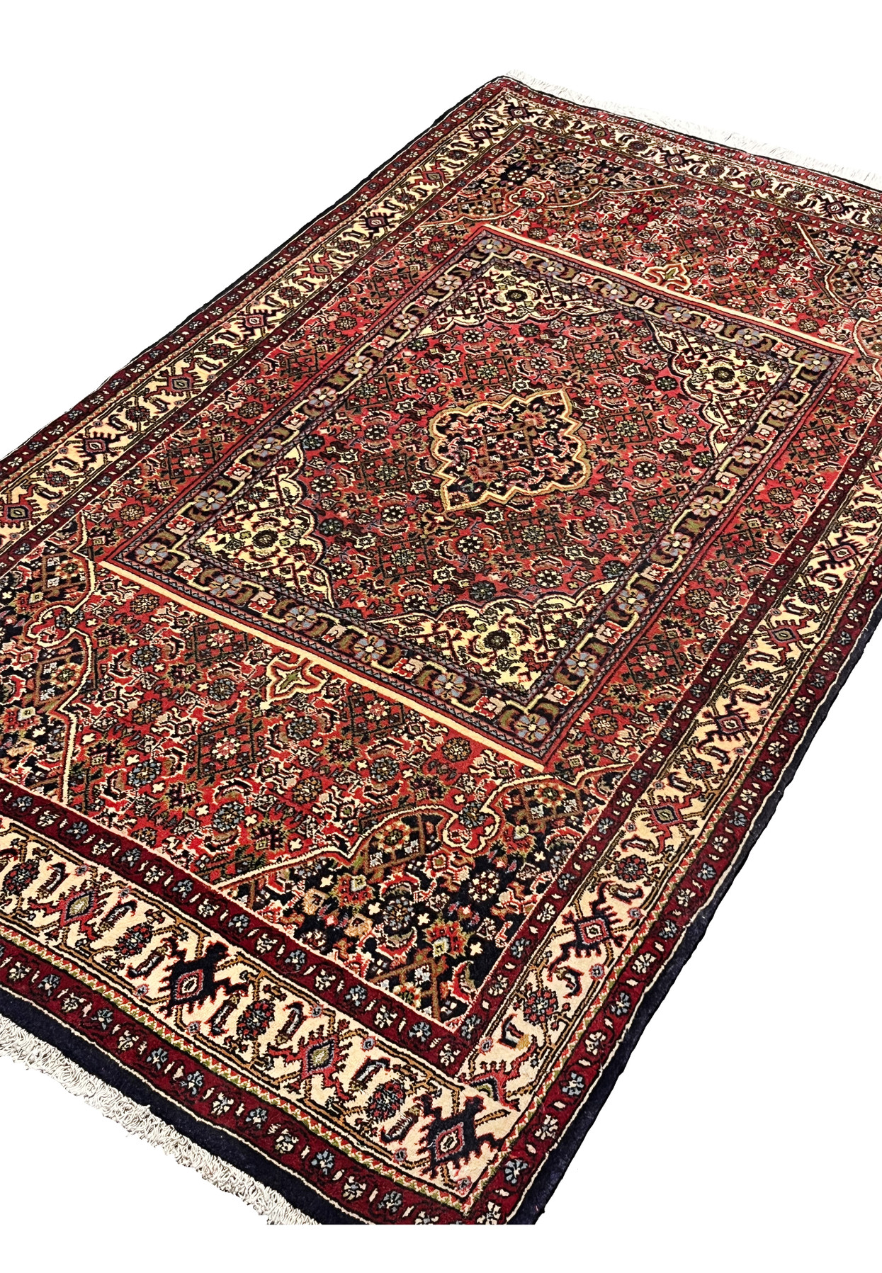 Angled perspective of a Persian Bijar rug emphasizing thick wool pile, compact structure, rug-in-rug layout, and durable construction