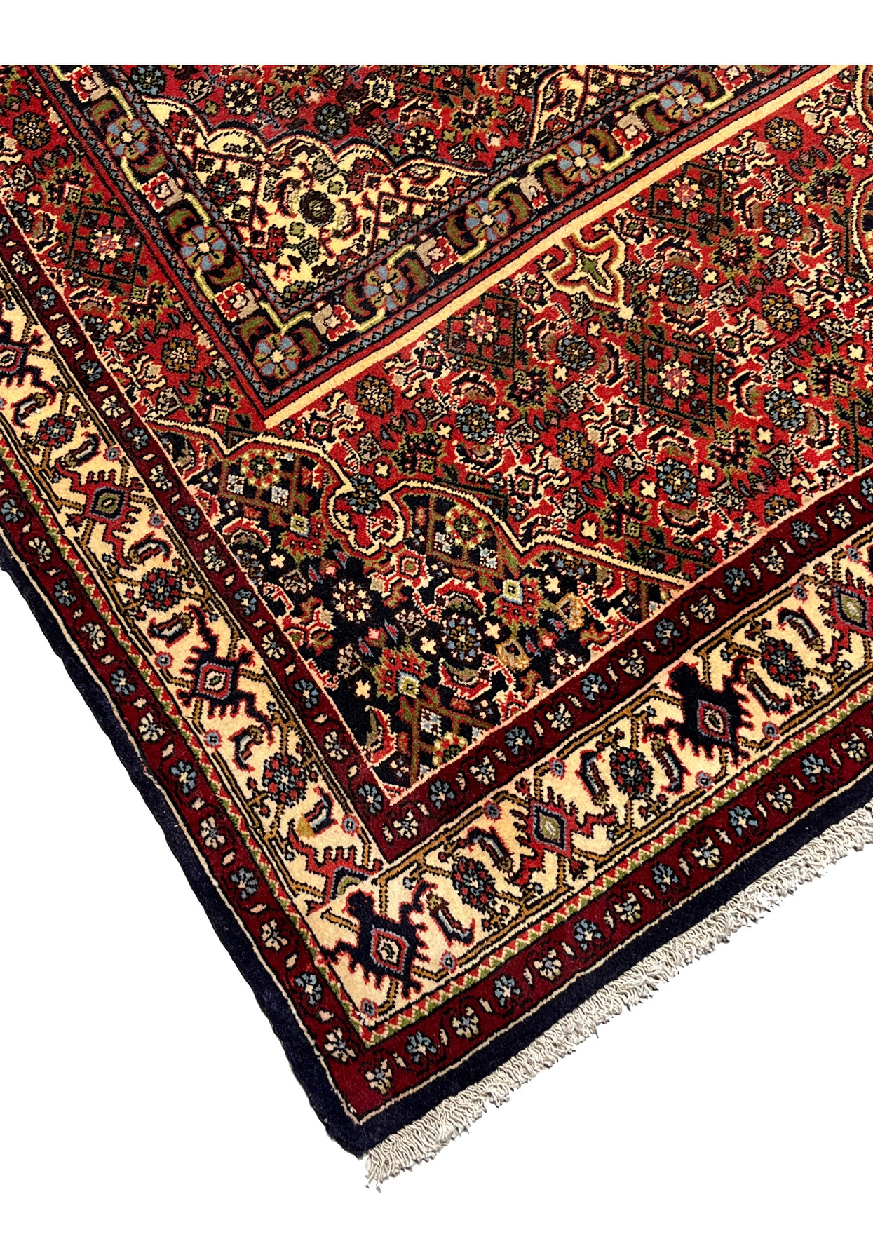 Edge detail of a Persian Bijar rug showing tight knotting, secure borders, dense weave, and the firm structure typical of iron rugs