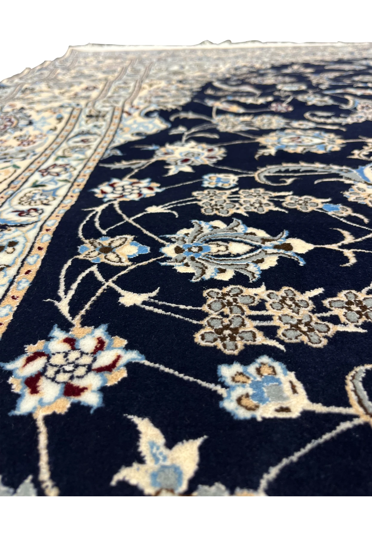 Pattern close-up of a handmade Persian Nain Habibian rug showing fine curvilinear floral motifs and scrolling vines woven with precise 6LA detail