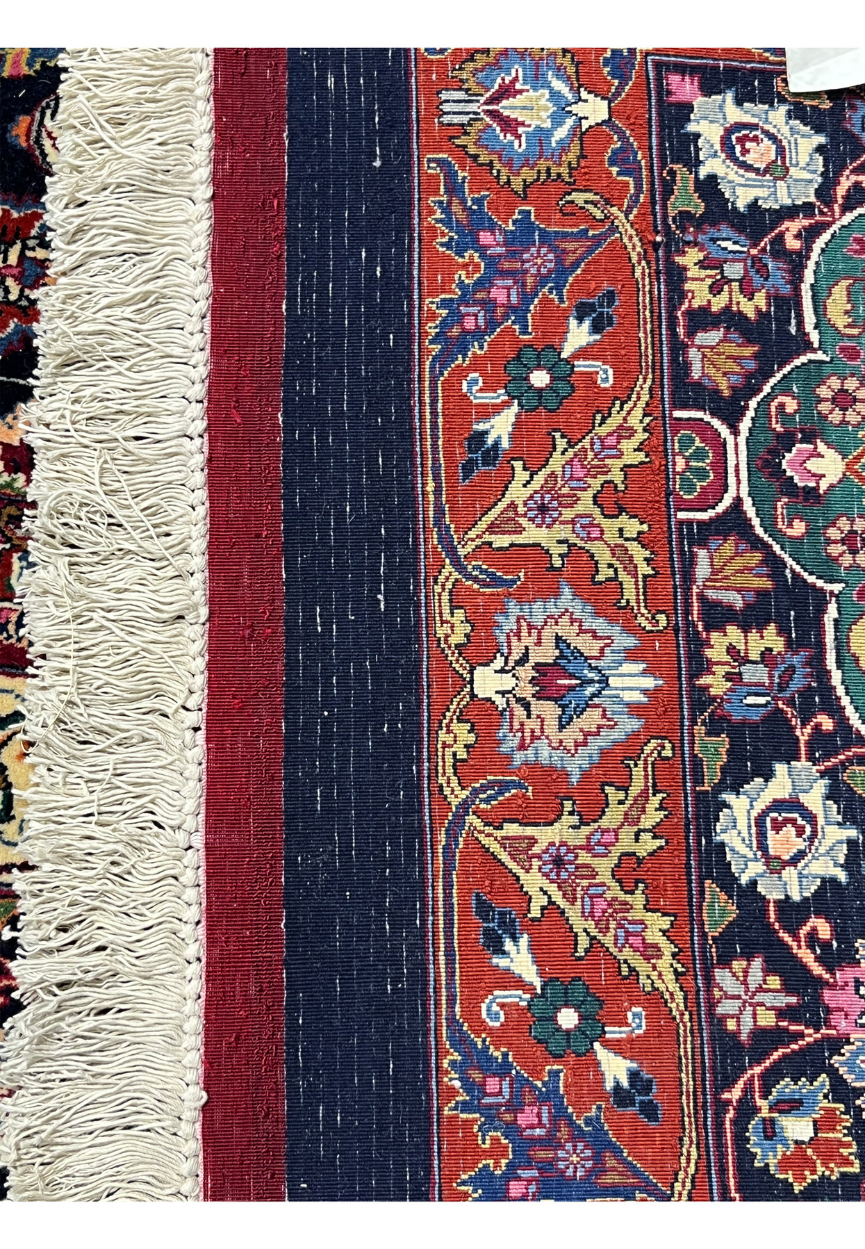 Backside view of a hand-knotted Persian Mashad rug revealing dense knot structure, precise craftsmanship, and the high-quality kork wool foundation.