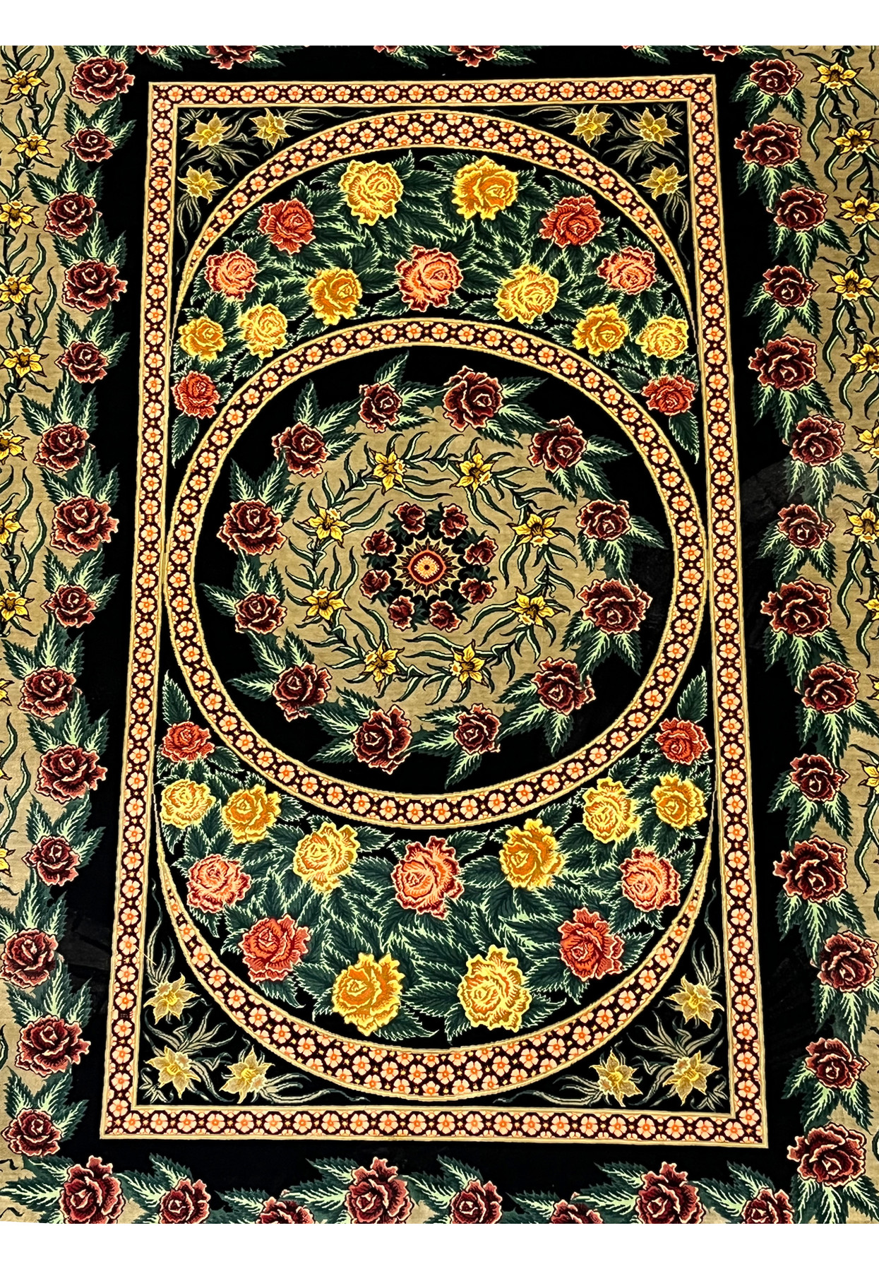 Midfield detail of a Persian Qum pure silk rug highlighting layered oval medallions, dense floral motifs, and sharp silk definition against a deep black ground