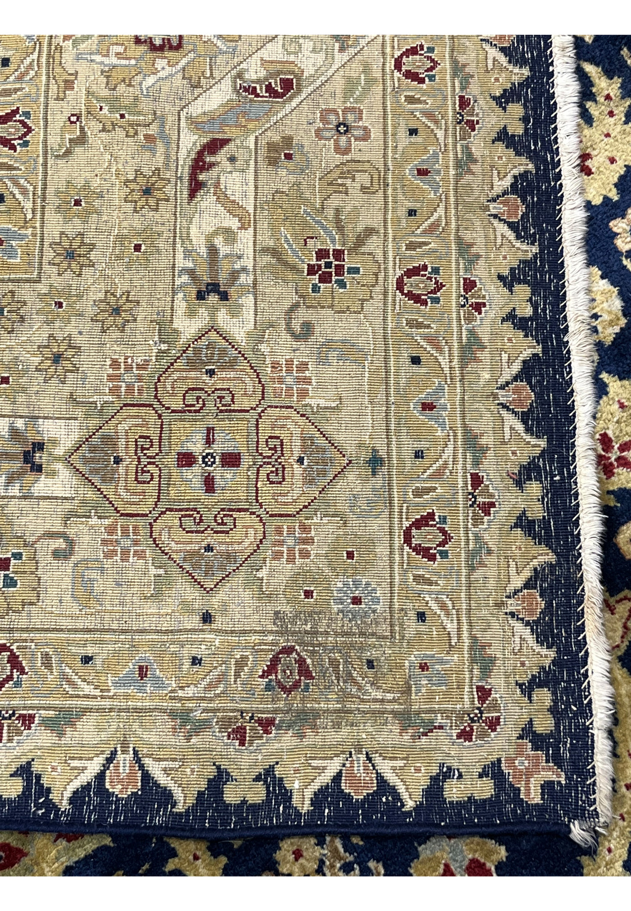 Backside view of a used 8' x 10' distressed Oriental Agra rug from India, showing handwoven foundation, age-related wear, minor color loss, and restored edges