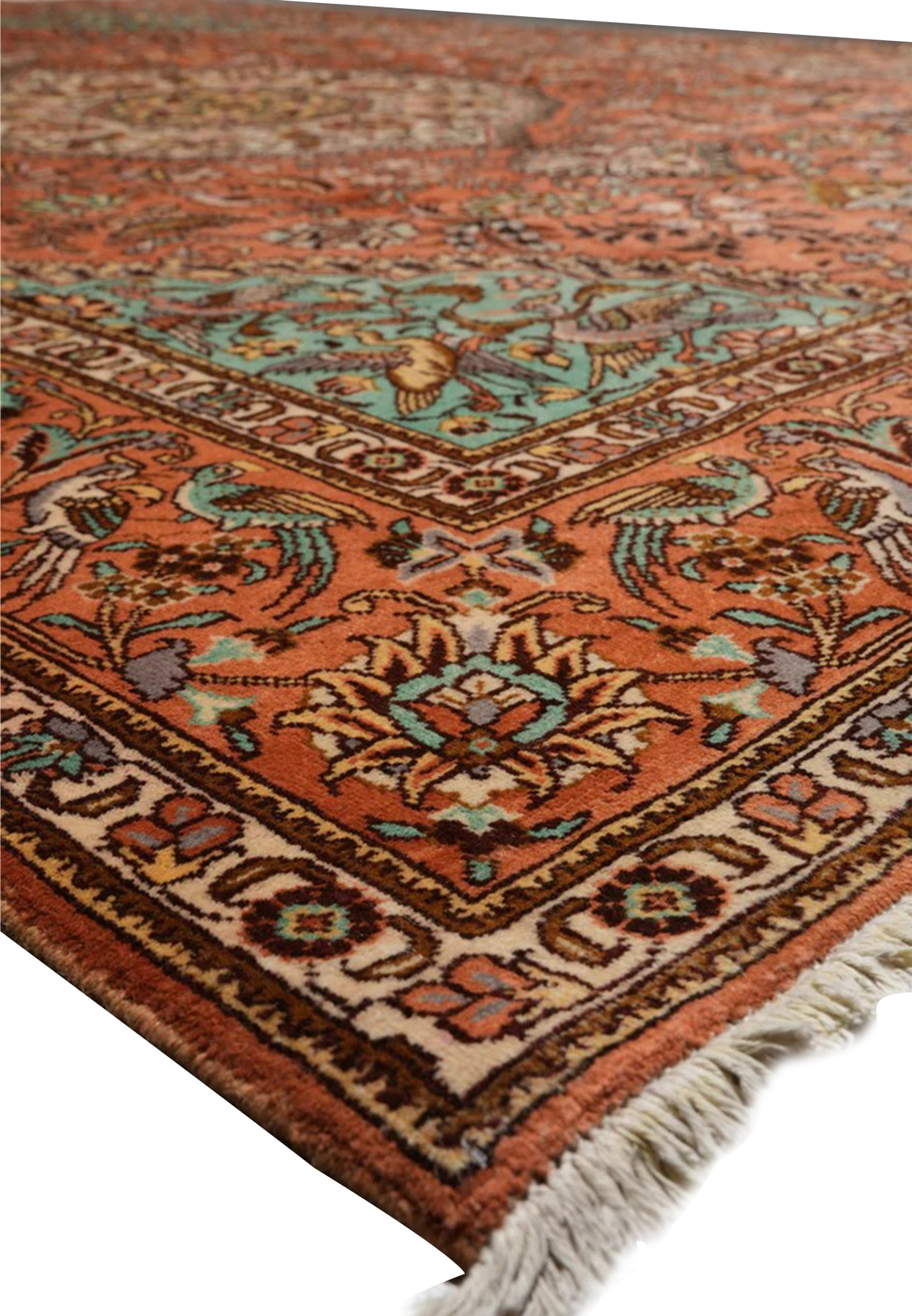 Edge detail of a signed Persian Tabriz Paradies rug highlighting tight weave, fine finishing, and clean cotton foundation structure