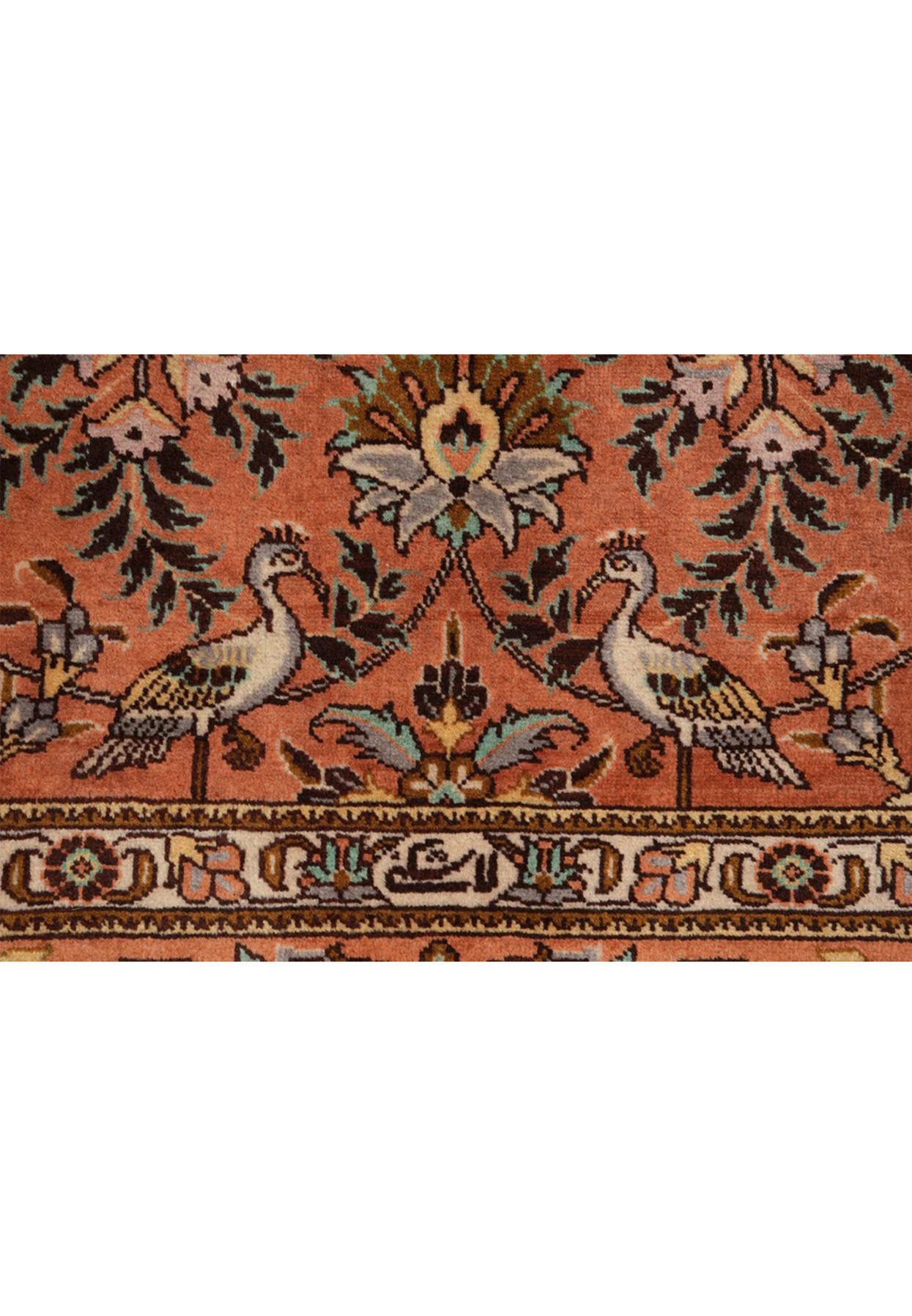 Close-up showing birds and woven signature on a Paradies Persian Tabriz rug, highlighting symbolic design and fine kork wool detail