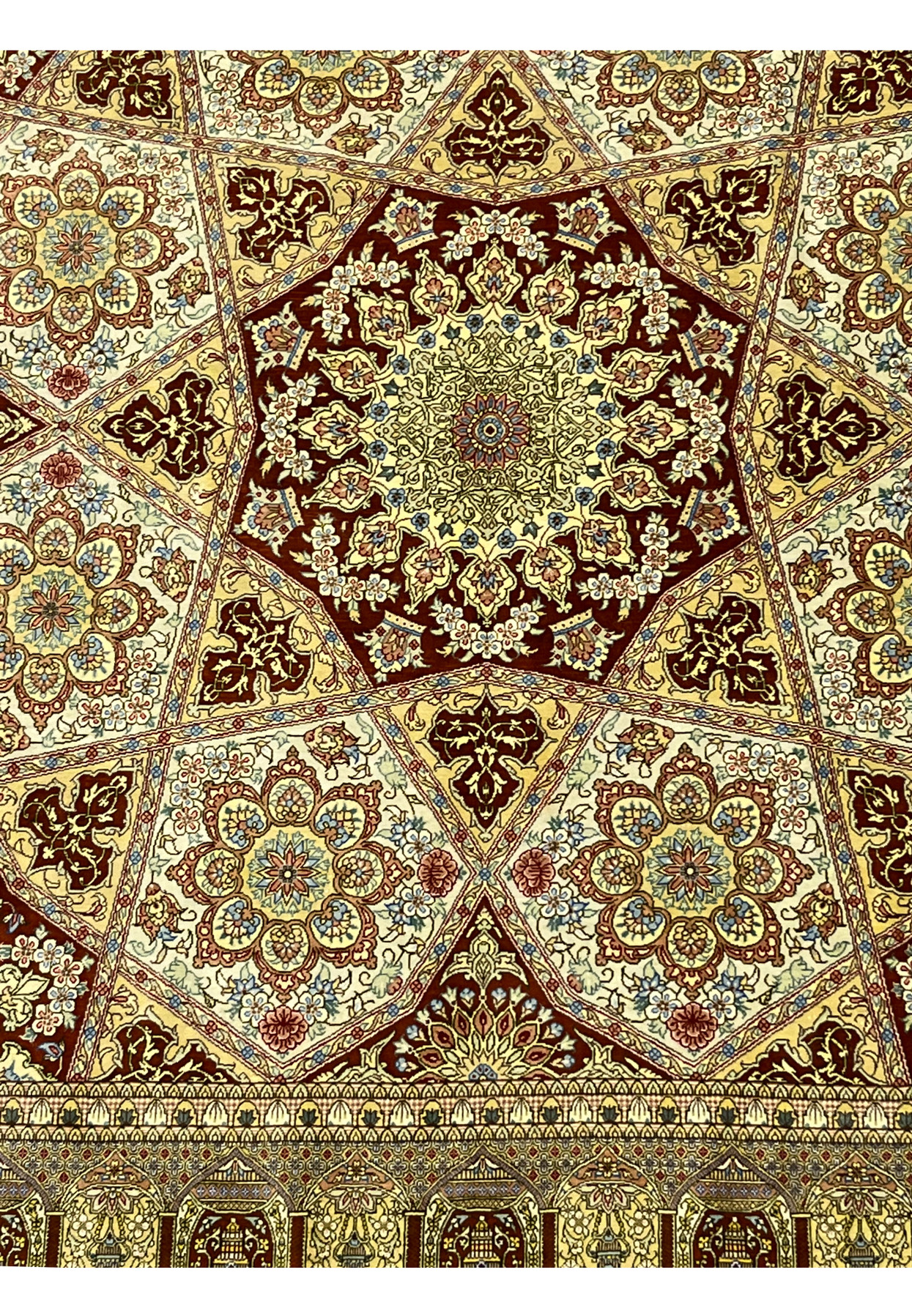 Lower section of signed Amjadi Persian Qum silk rug showing border alignment, floral motifs, and fine silk weaving clarity