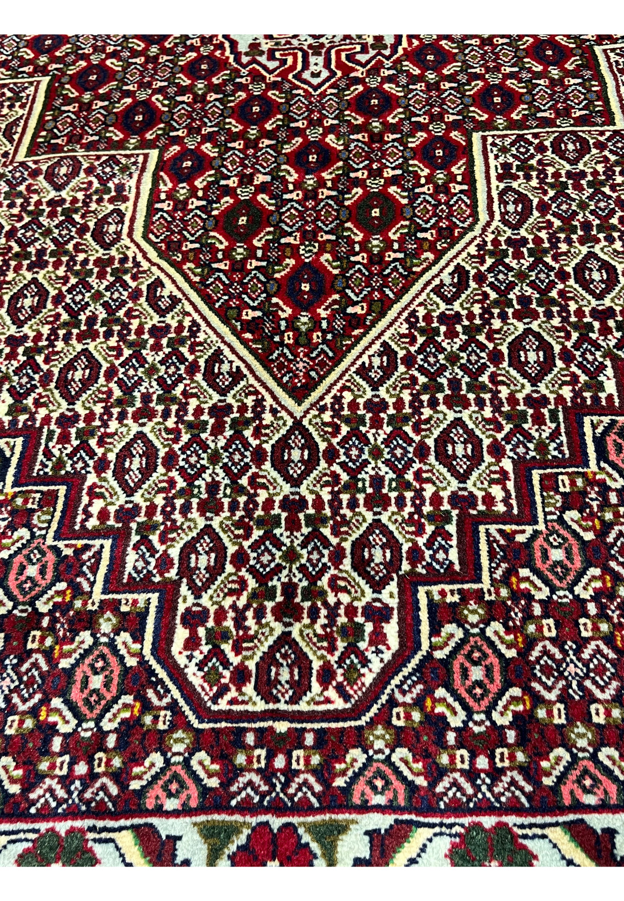 Face and foundation close-up of Persian Senneh rug revealing tight knot structure, clean weaving, precise color changes, and durable wool build