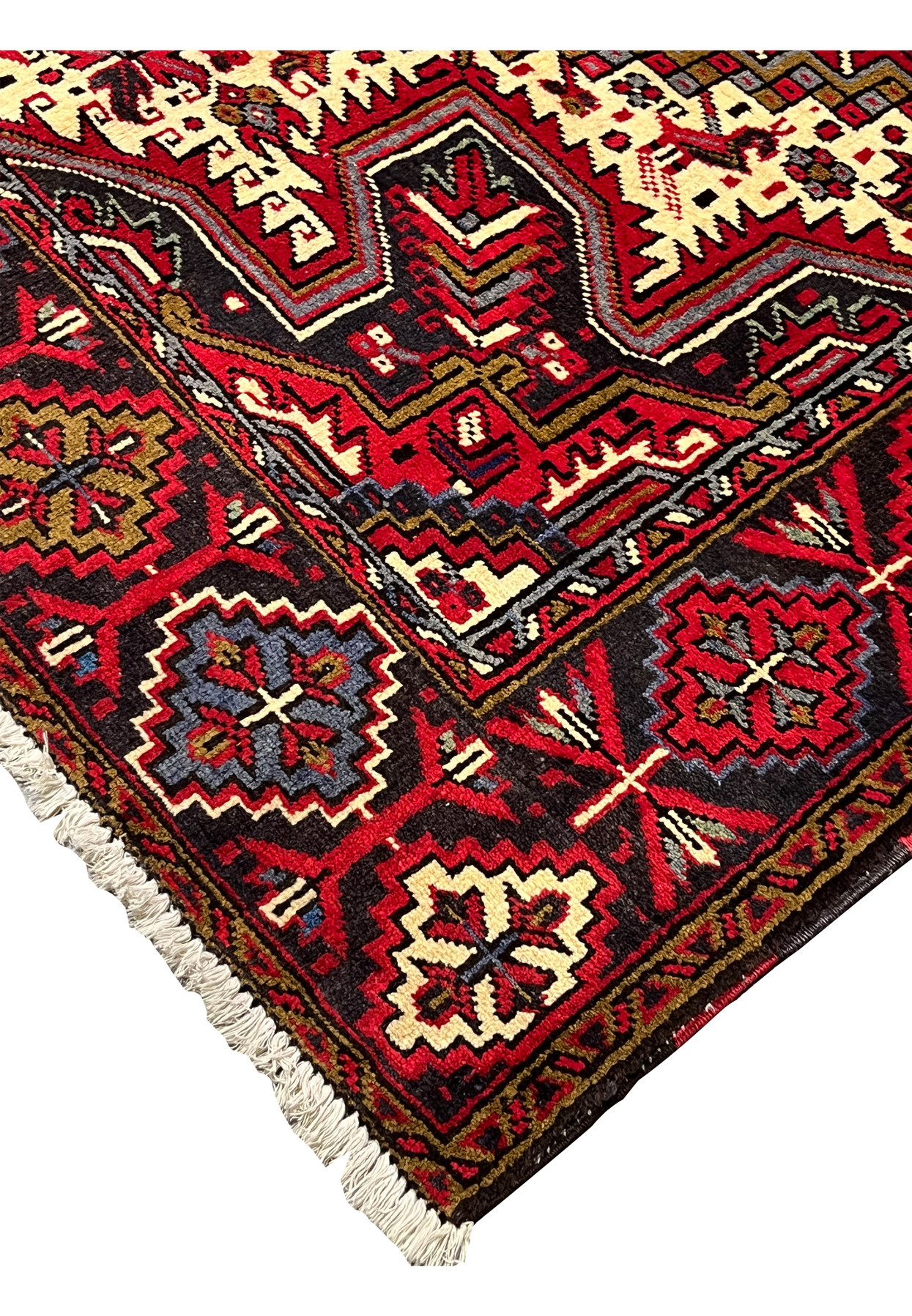 Edge and side binding of hand knotted Heriz rug showing sturdy selvedge wool construction tight knots and durable finish