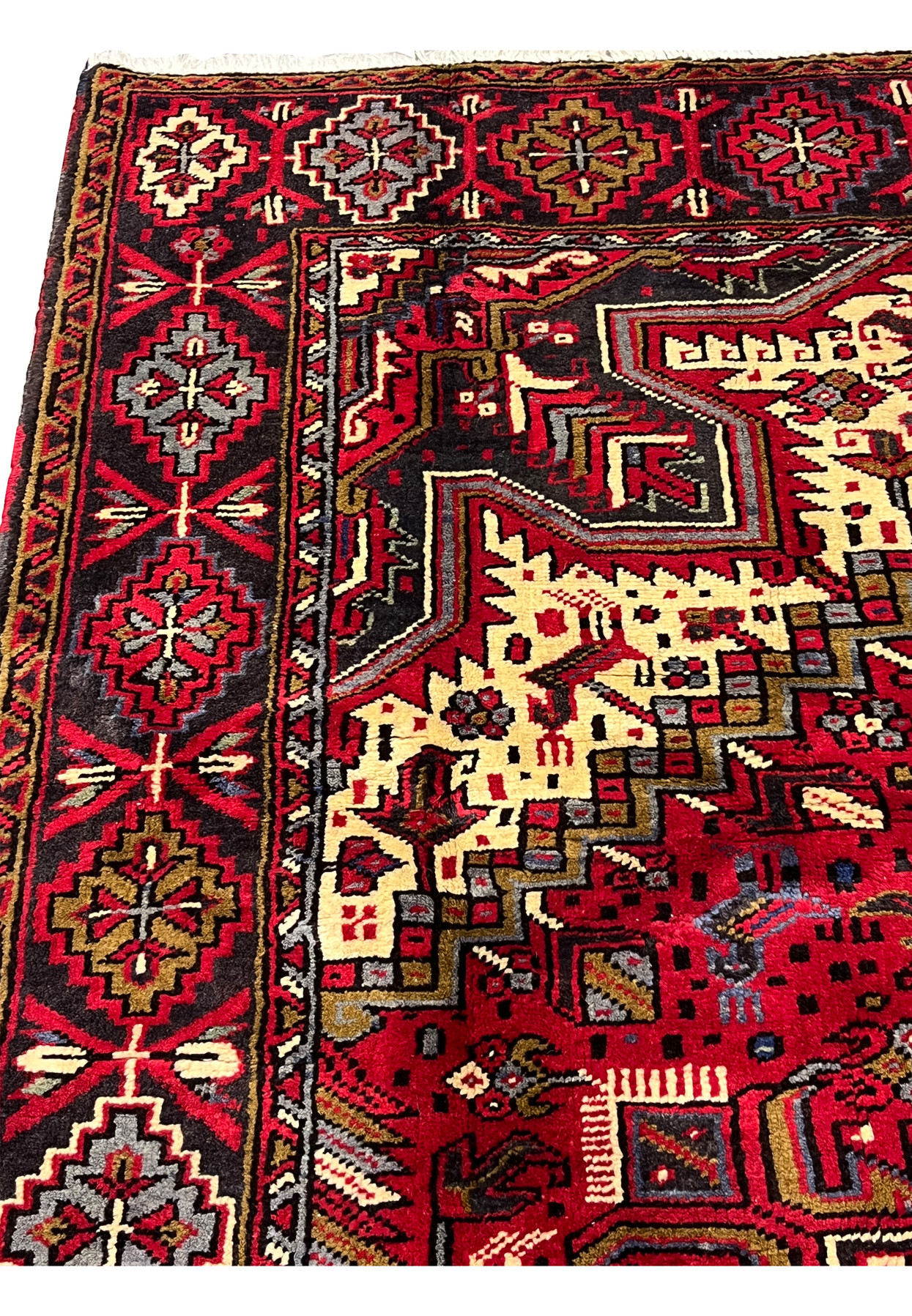 Top edge and fringe area of hand knotted Persian Heriz rug showing selvage binding, clean finishing and durable wool construction with crisp details